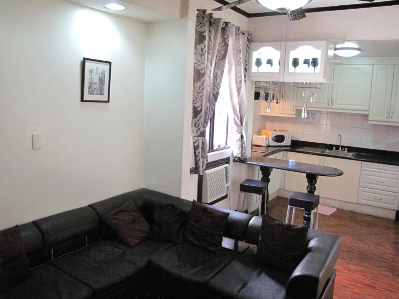 Kitchen or kitchenette in Makati Suites at Travelers Inn