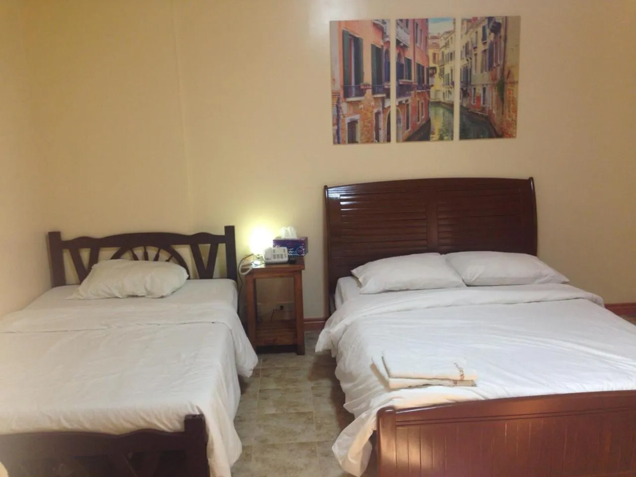 Bed in Makati Suites at Travelers Inn