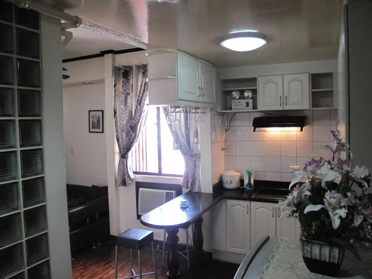 Kitchen or kitchenette in Makati Suites at Travelers Inn