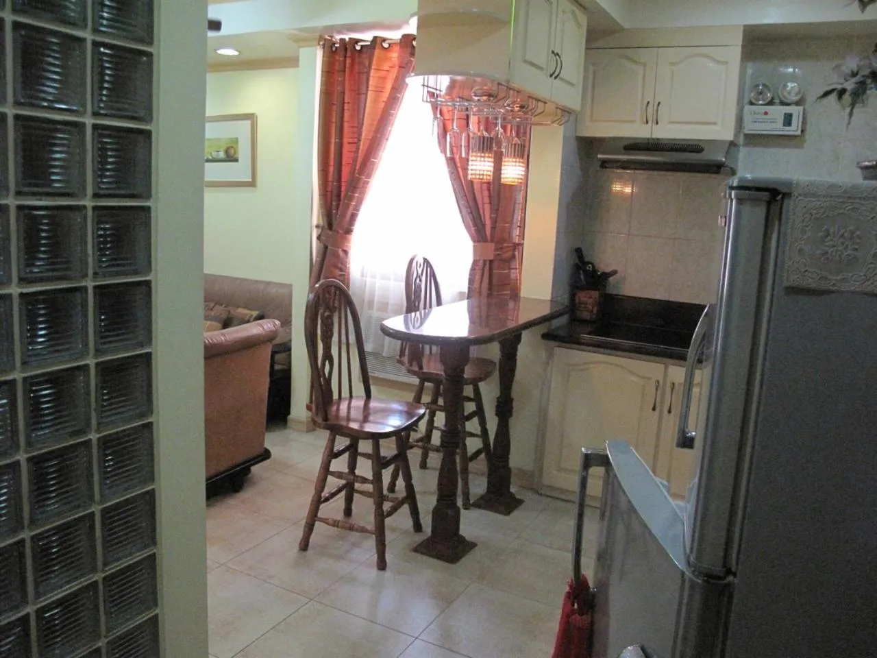 Kitchen or kitchenette in Makati Suites at Travelers Inn