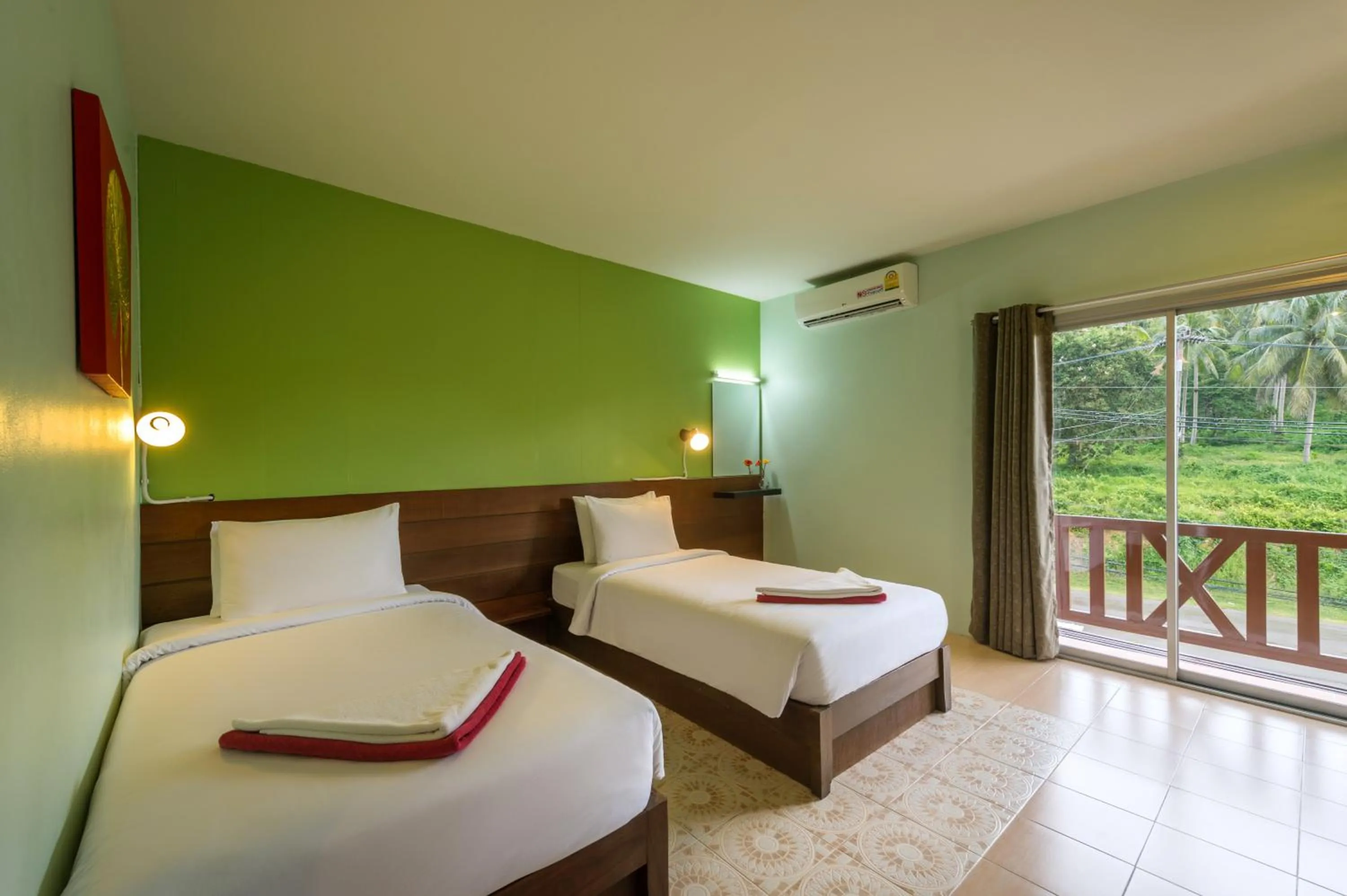 Bed in Lanta Thip House by Swiss-Belhotel