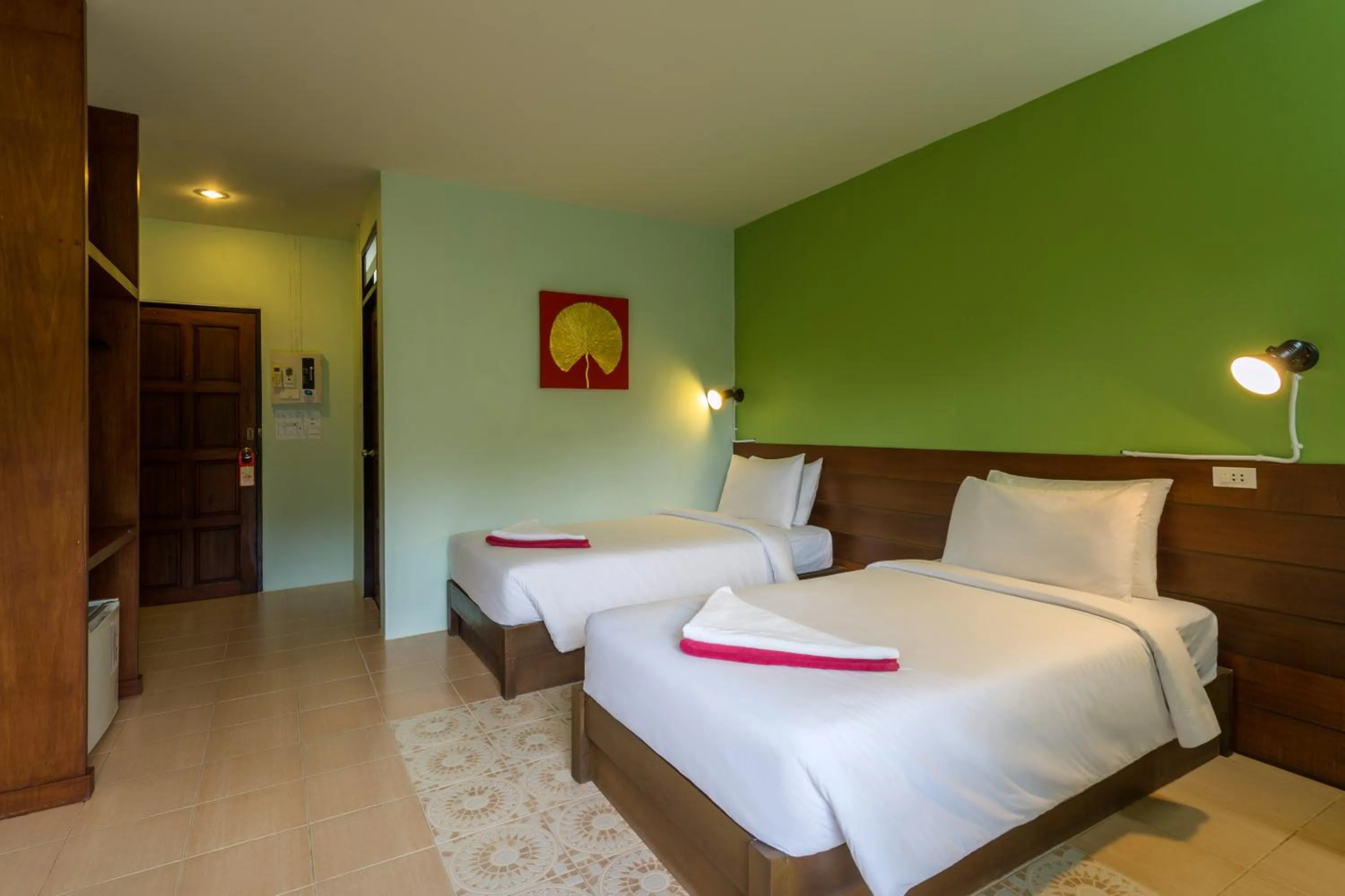 Bed in Lanta Thip House by Swiss-Belhotel