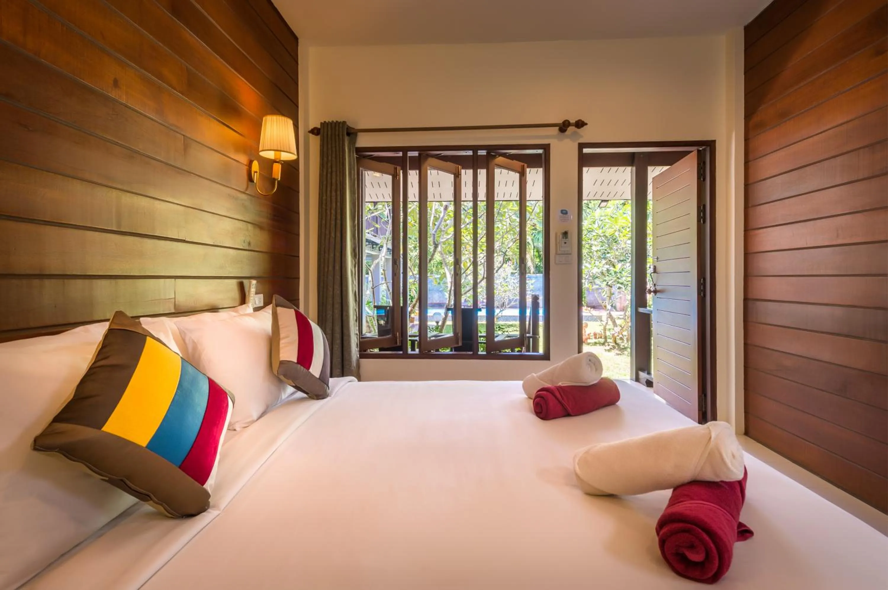 Bed in Lanta Thip House by Swiss-Belhotel