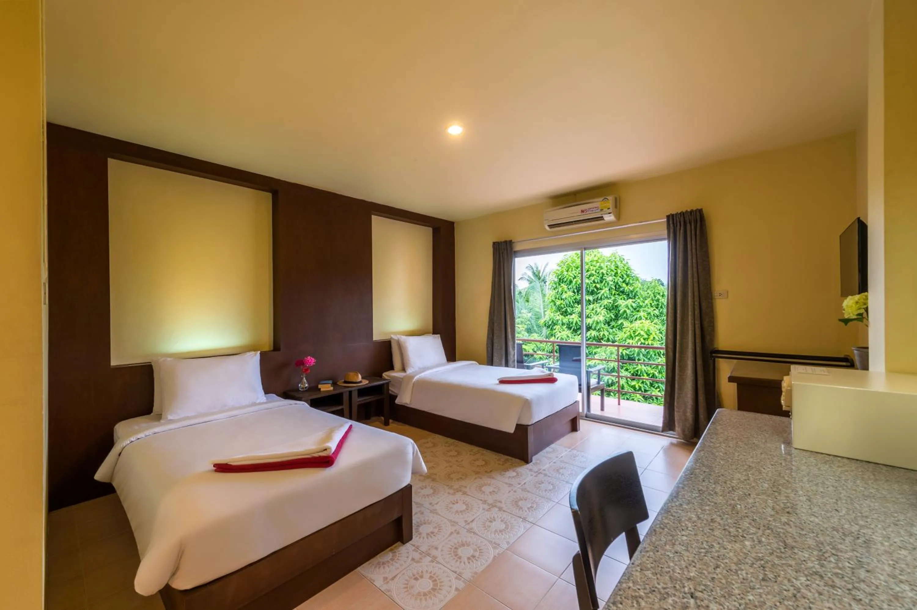 Bed in Lanta Thip House by Swiss-Belhotel