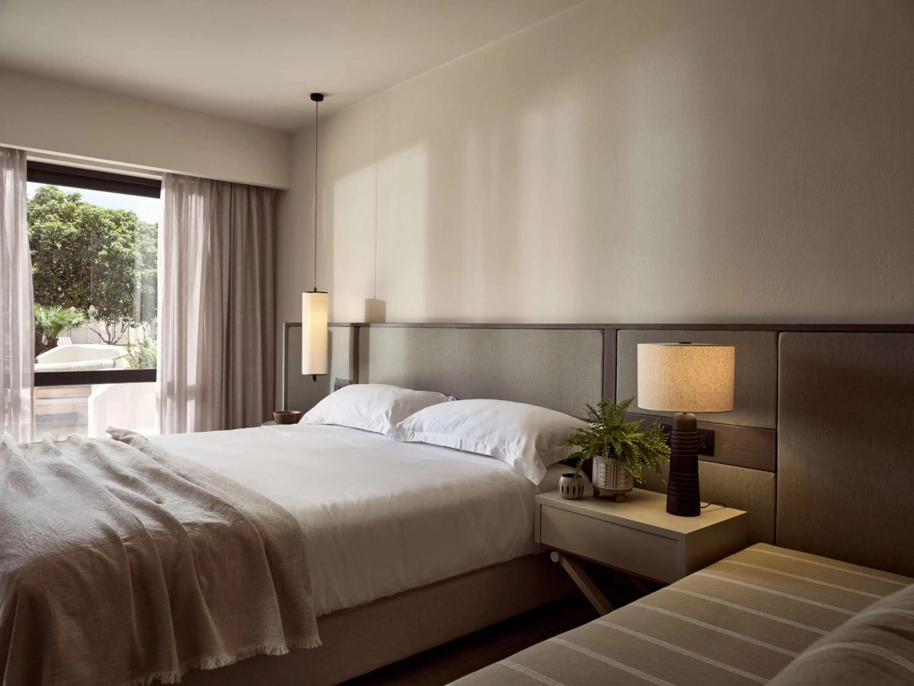 Bed in Numo Ierapetra Beach Resort Crete, Adults only, Curio Collection Hilton
