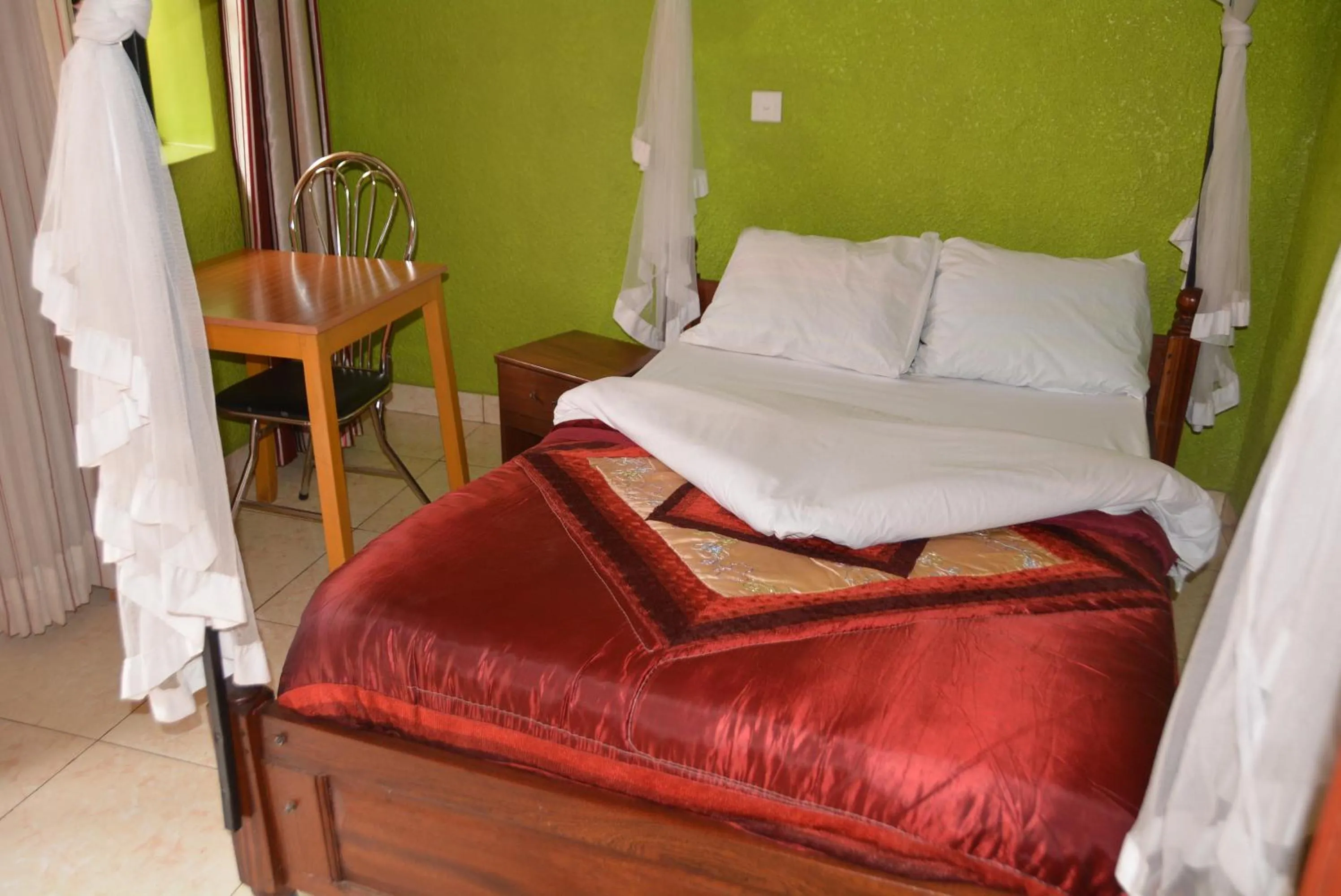 Bed in La Voisina Hotel