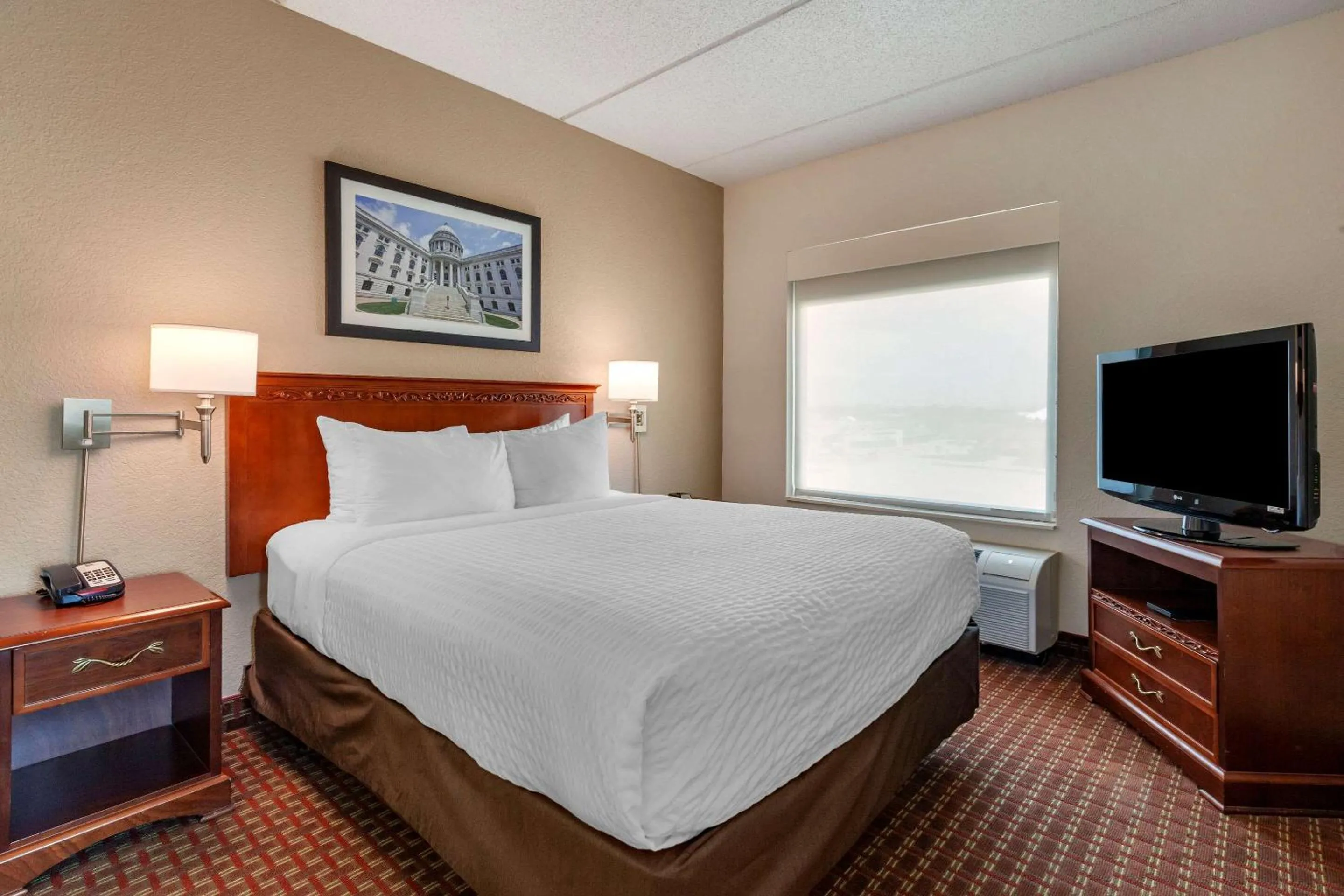 Bedroom in Clarion Suites at The Alliant Energy Center