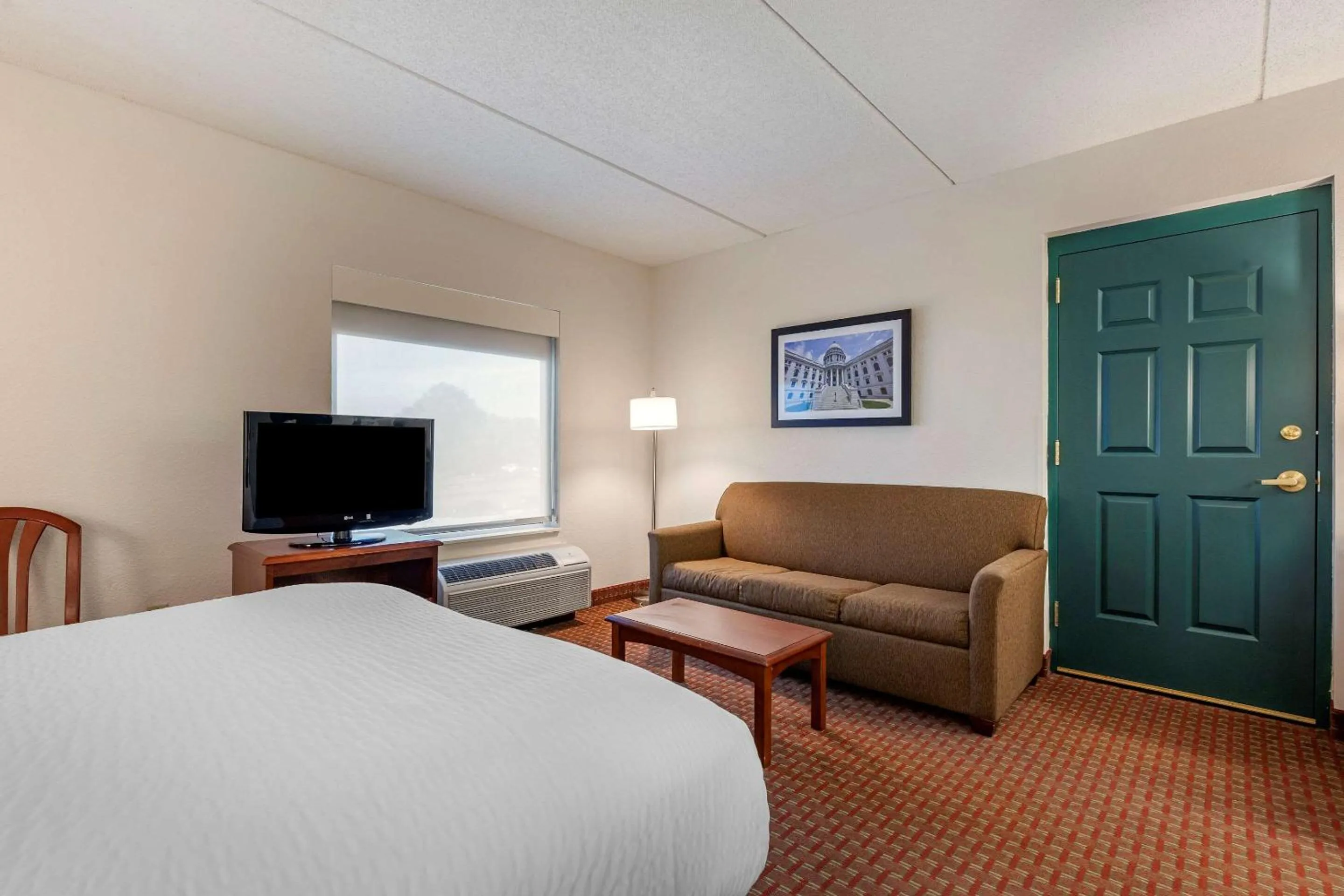 Bedroom in Clarion Suites at The Alliant Energy Center
