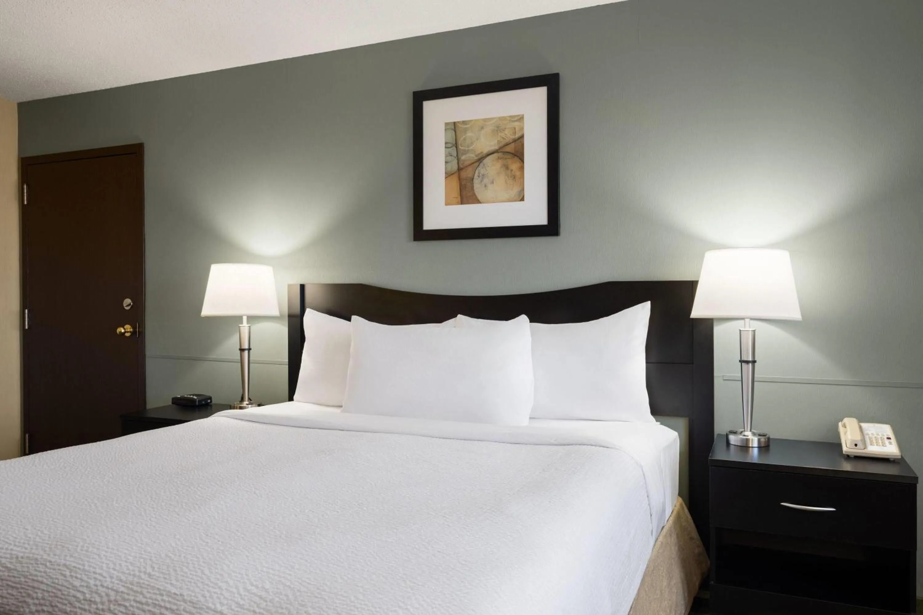 Photo of the whole room, Bed in Ramada by Wyndham Saskatoon