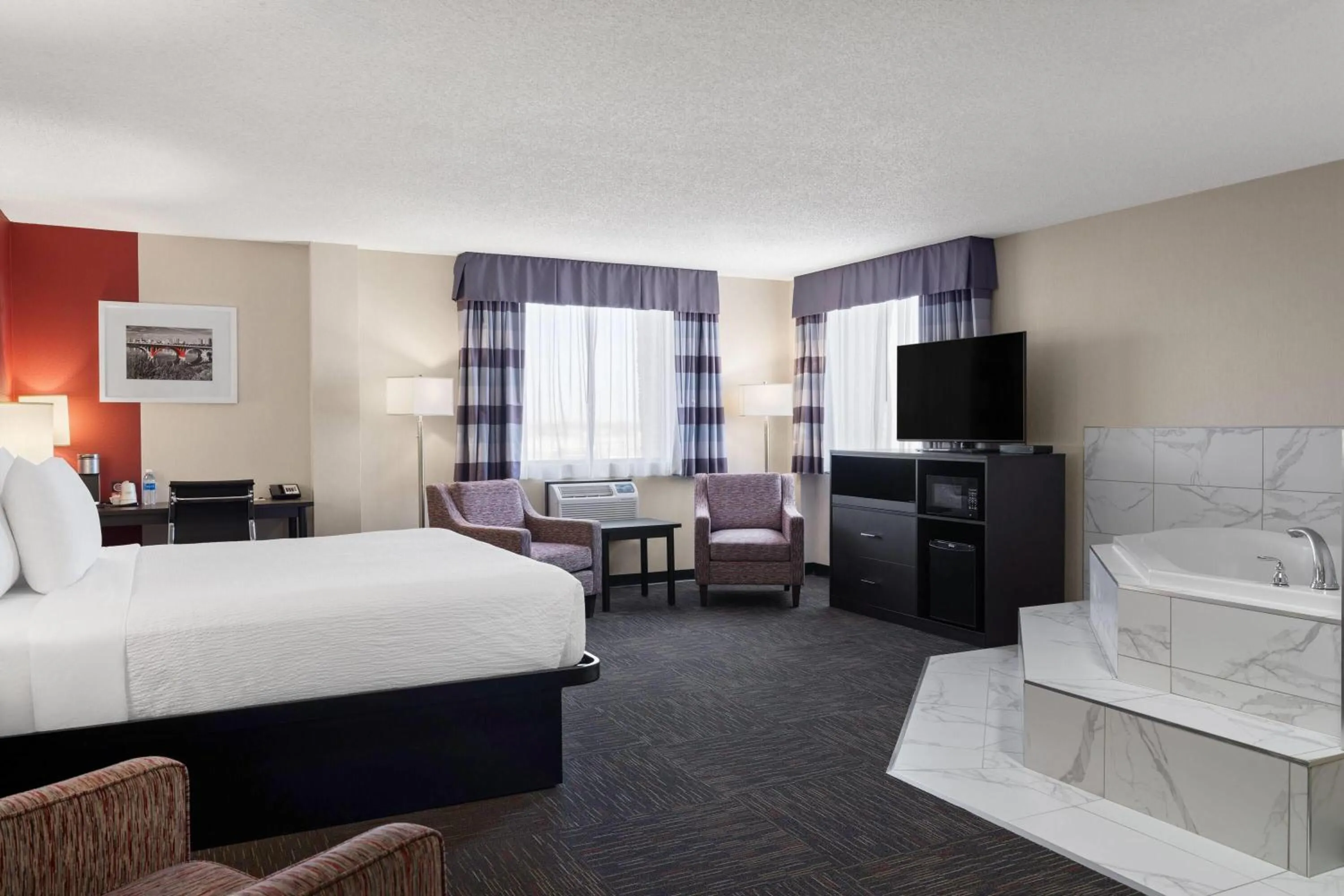 Photo of the whole room, Bed in Ramada by Wyndham Saskatoon