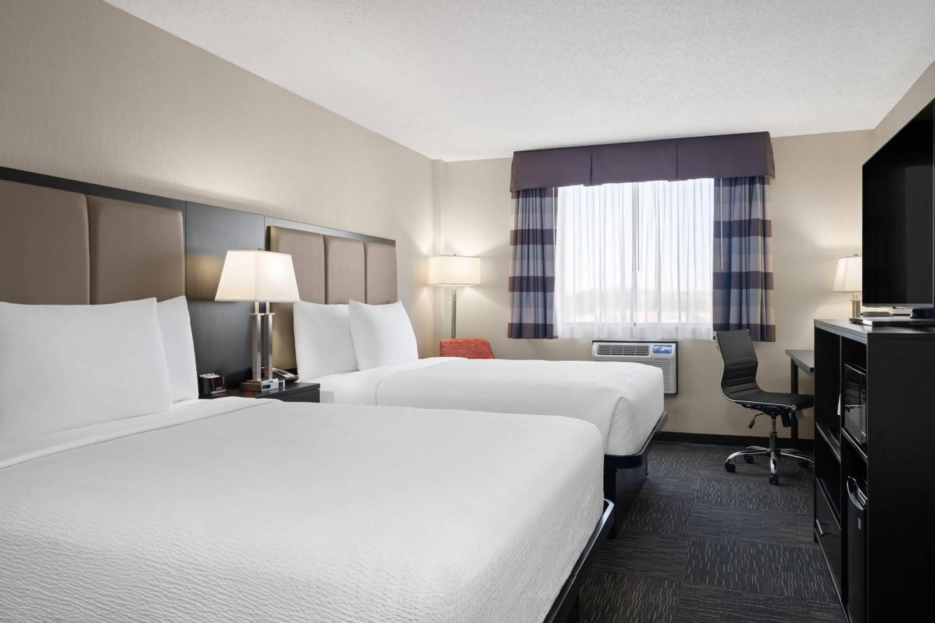 Photo of the whole room, Bed in Ramada by Wyndham Saskatoon