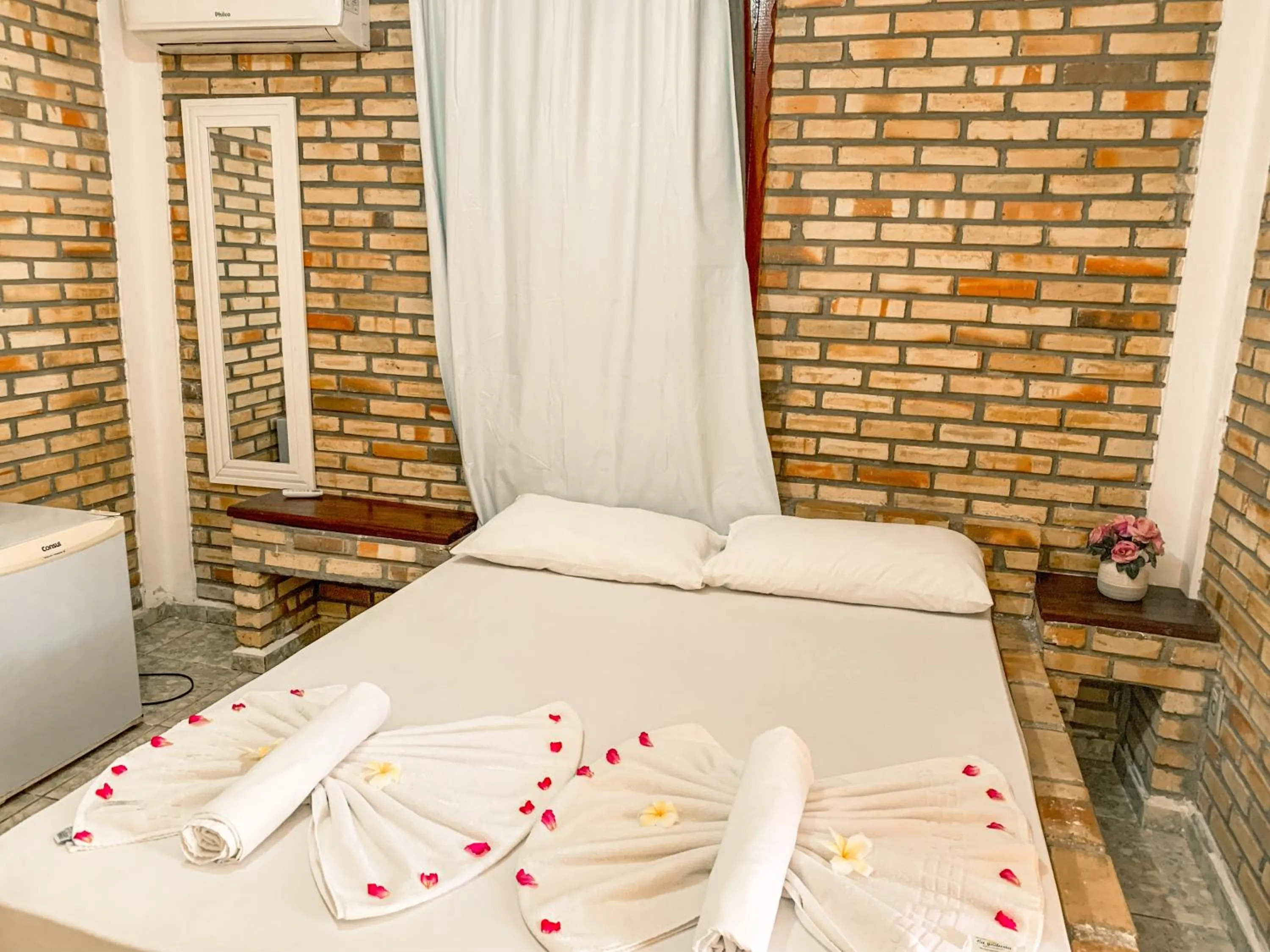 Bed in Pousada La Goduria