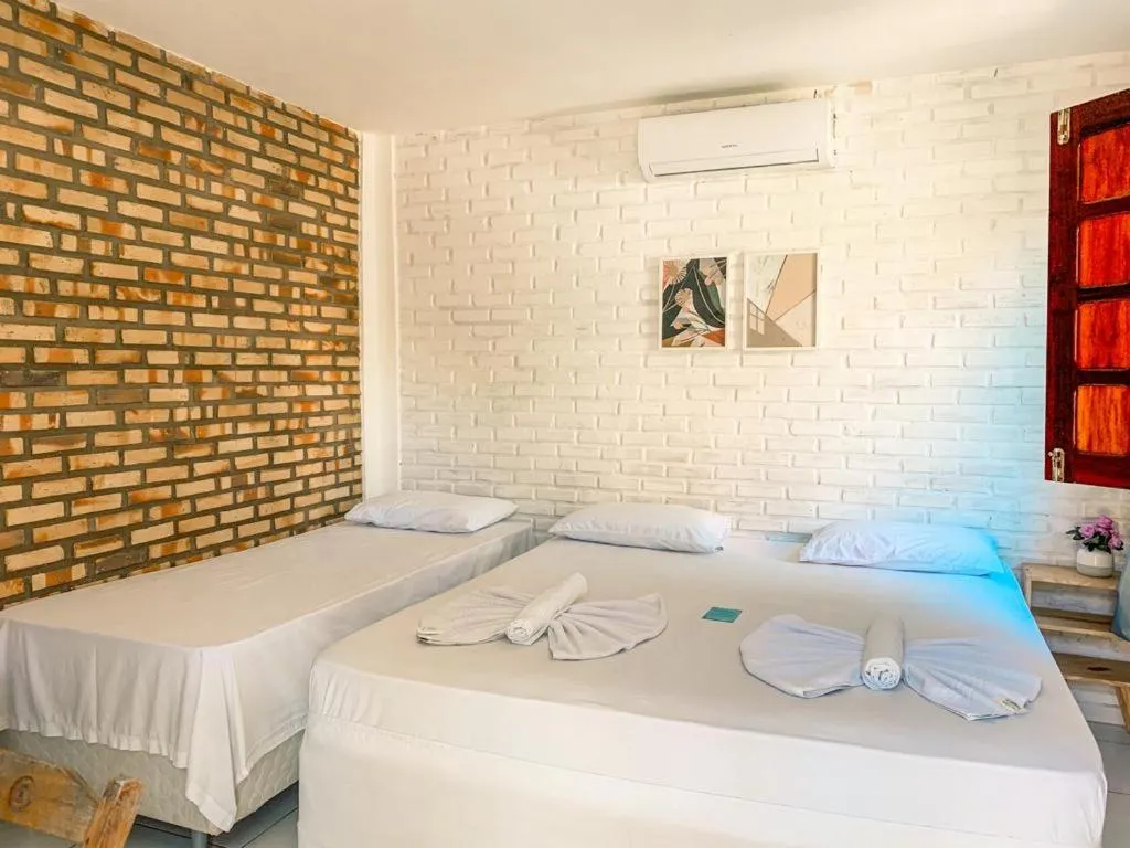 Bed in Pousada La Goduria