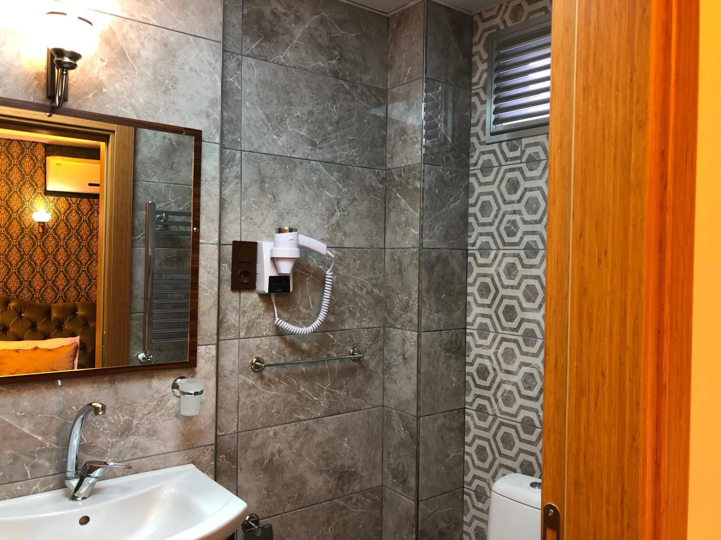 Bathroom in Rose Mansion by Otantik Suites