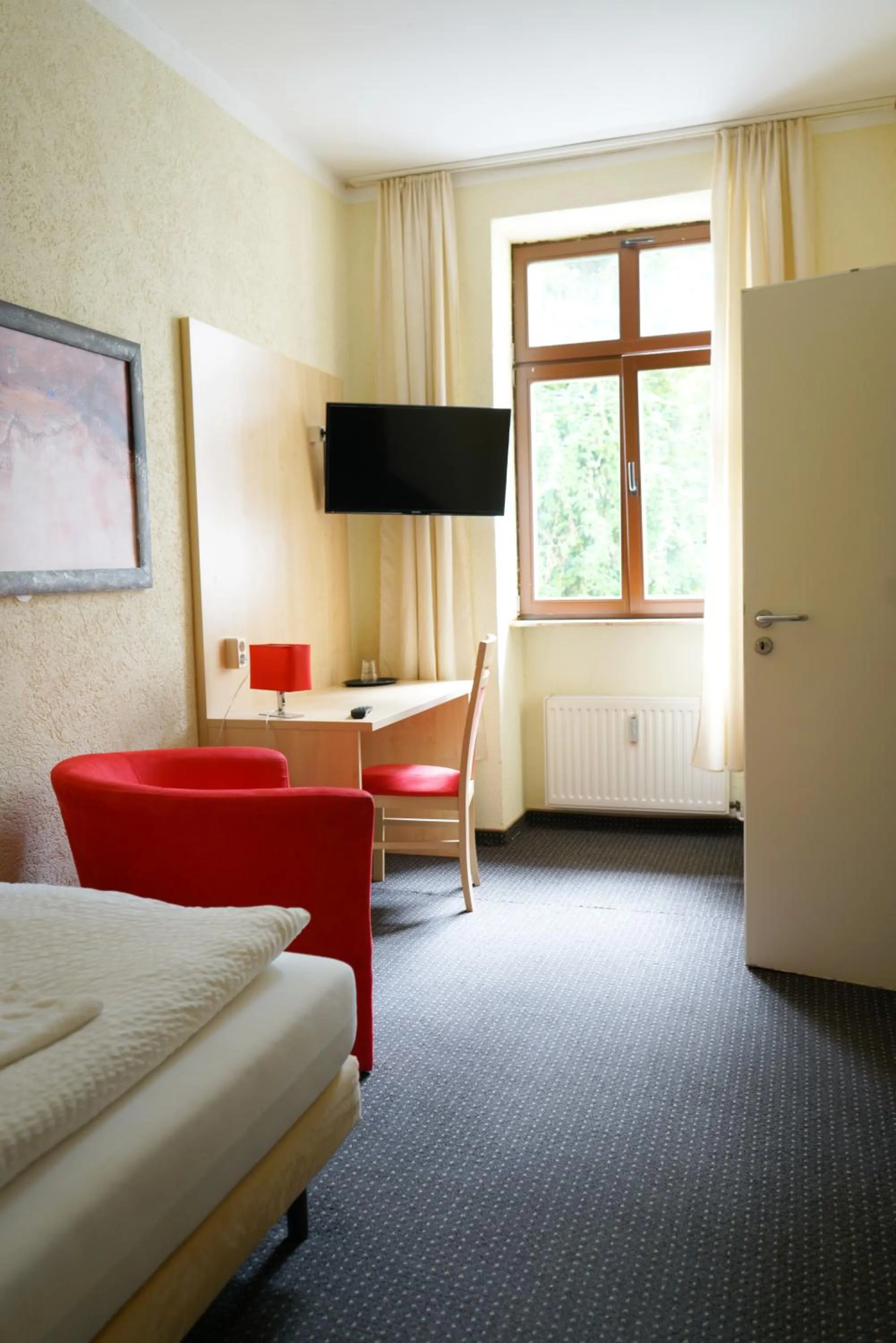 TV and multimedia, Bed in Gästehaus Lisakowski Pension am Brautwiesenpark