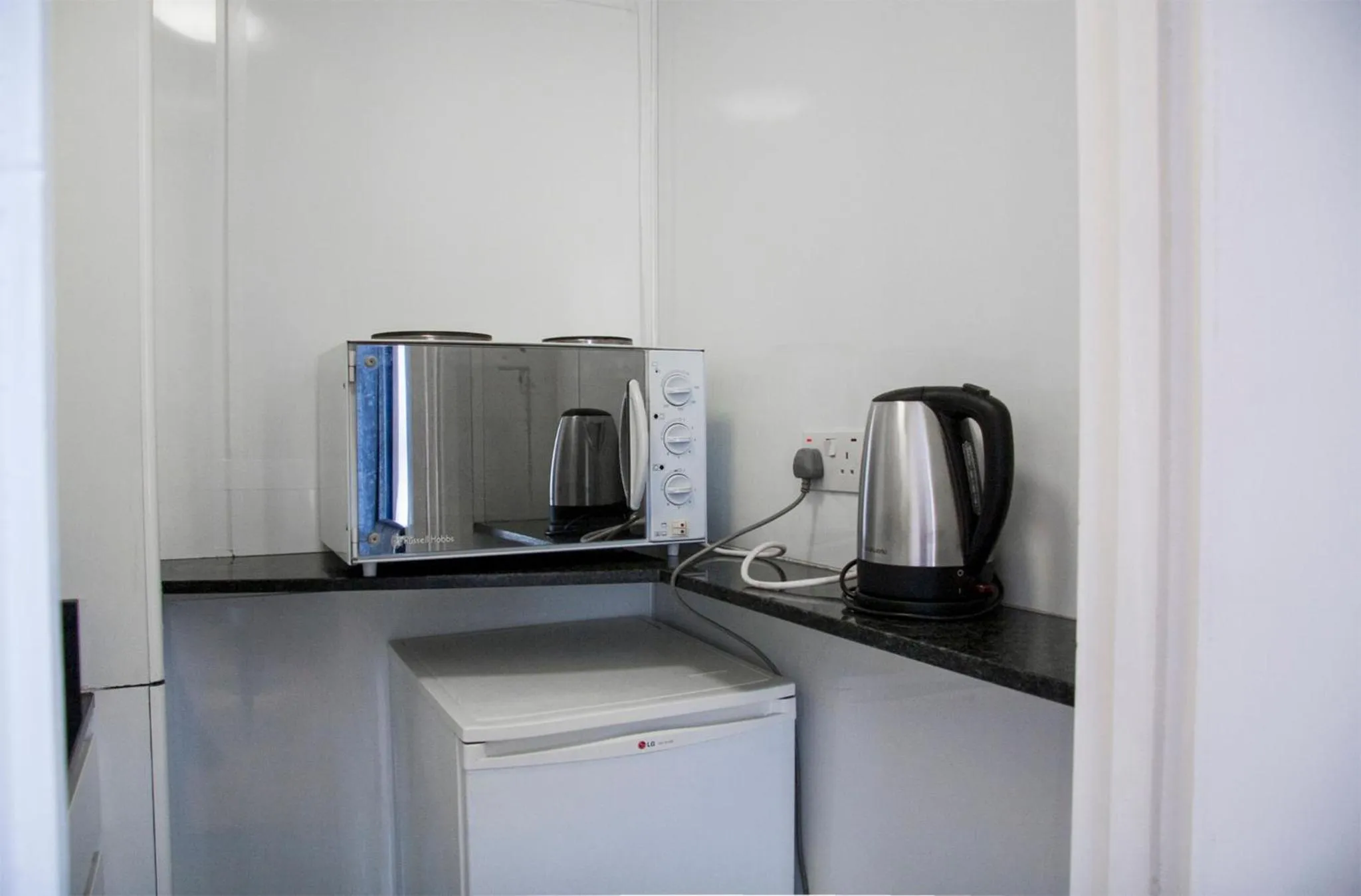 Kitchen or kitchenette in Caledonian Studio Flats