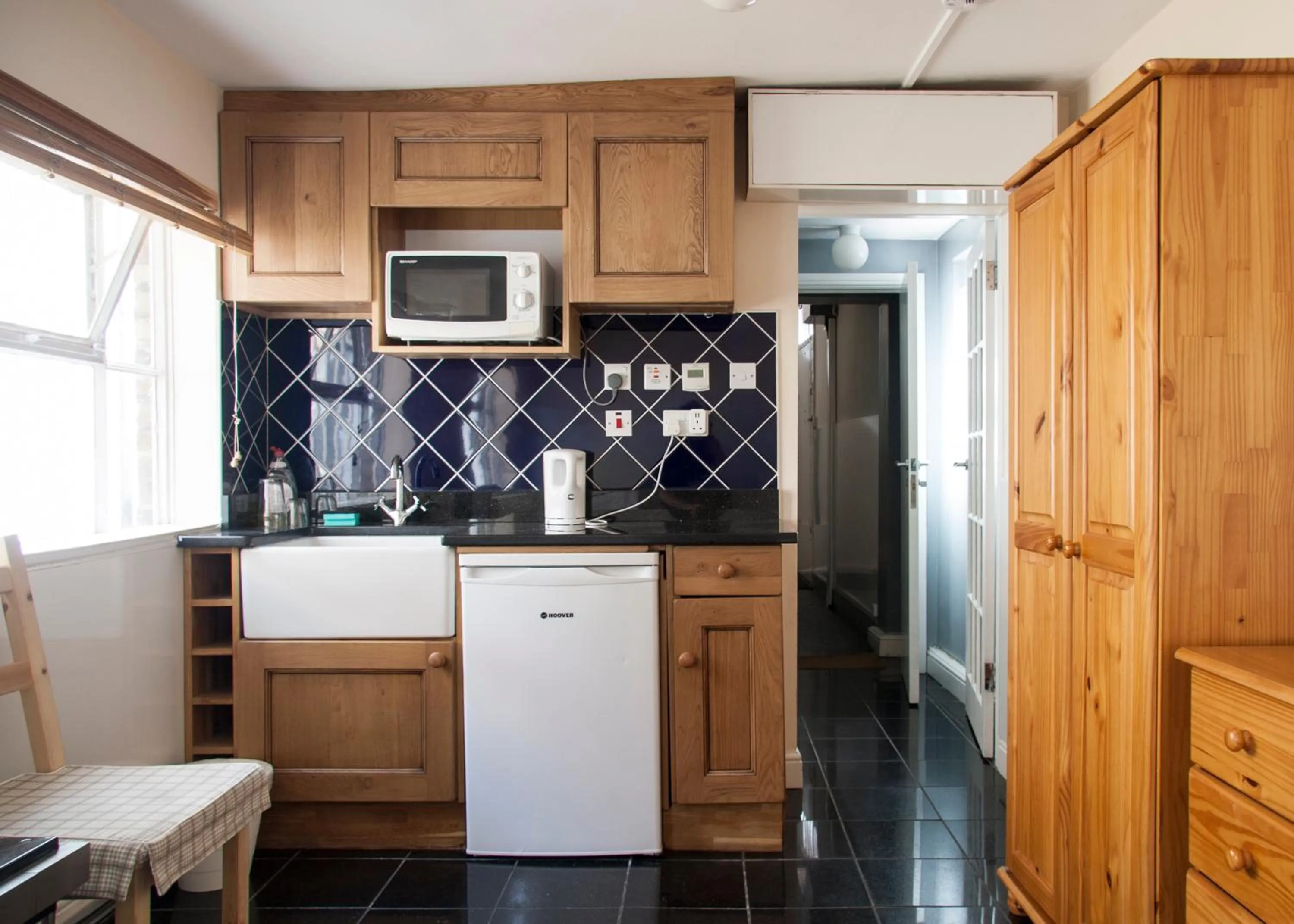 Kitchen or kitchenette in Caledonian Studio Flats