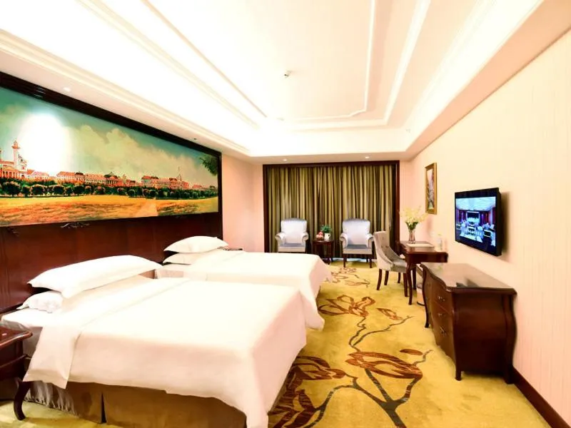 Bed in Vienna Hotel Loudi Chunyuan Pedestrian Street