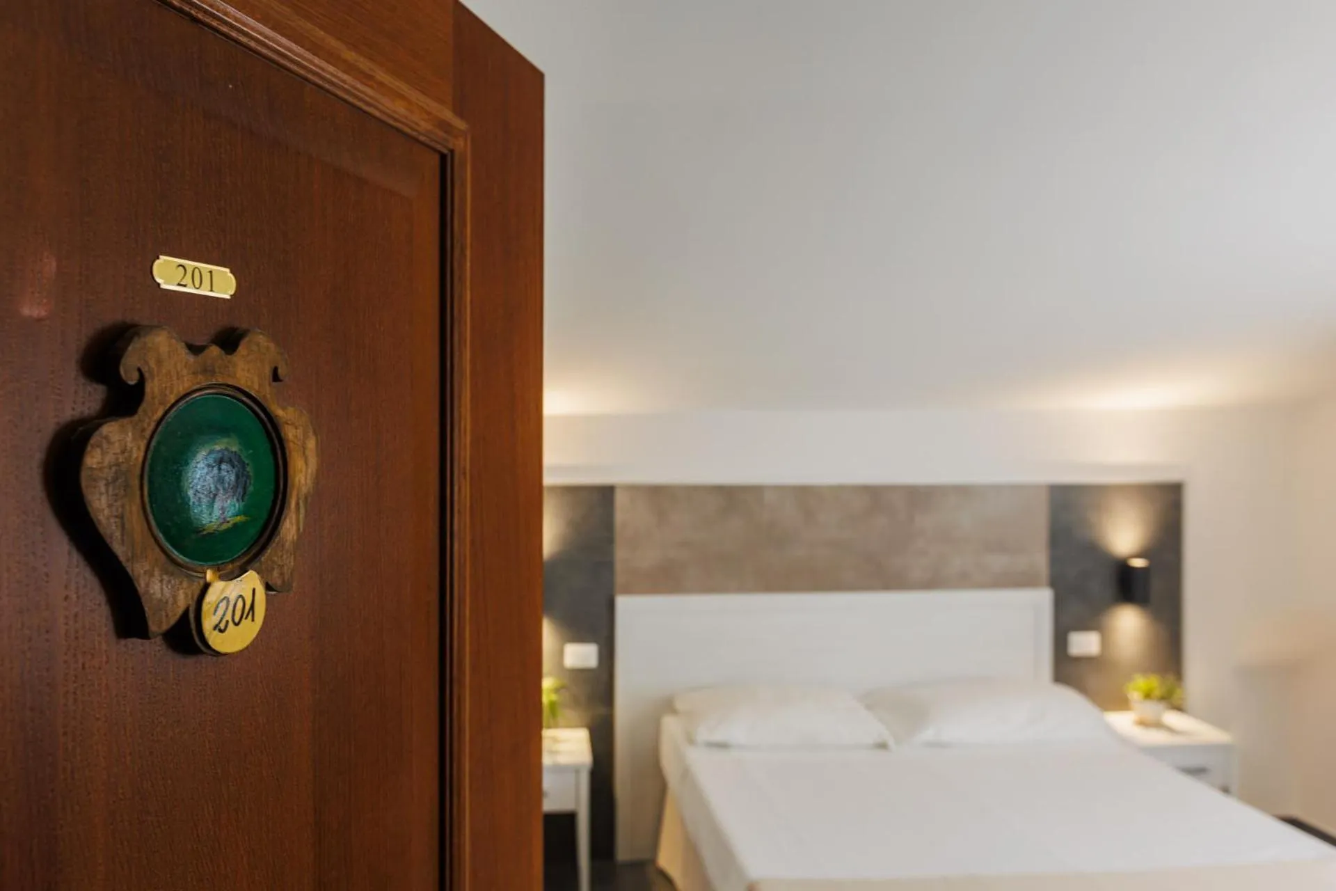 Bed in Hotel Le Mura