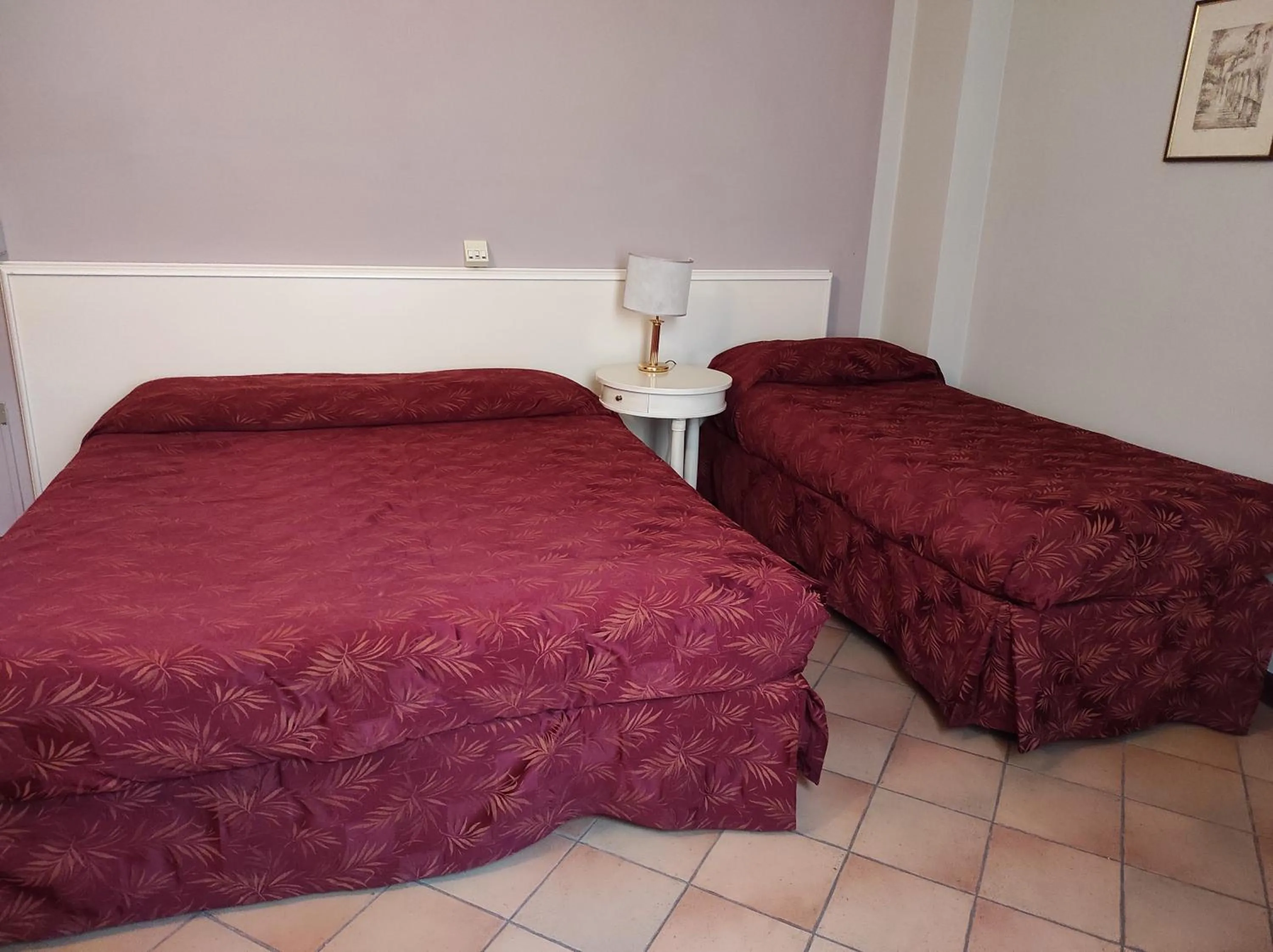 Bed in Hotel Le Mura