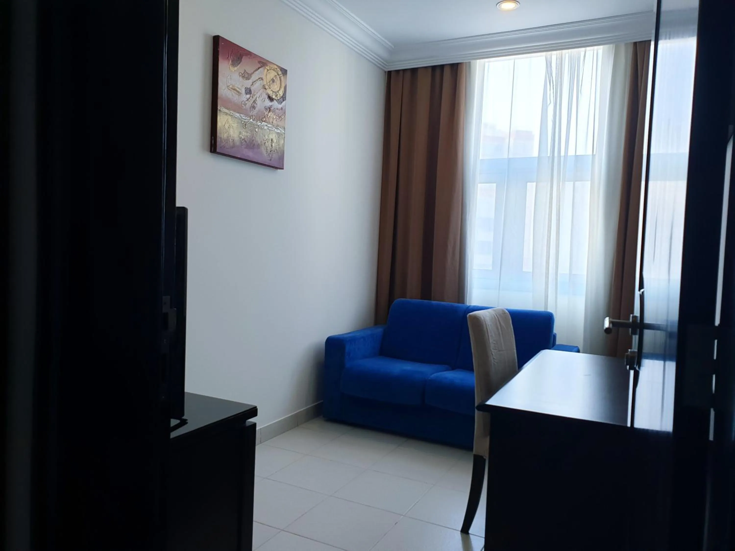 Living room in Costa Del Sol Hotel by Arabian Link