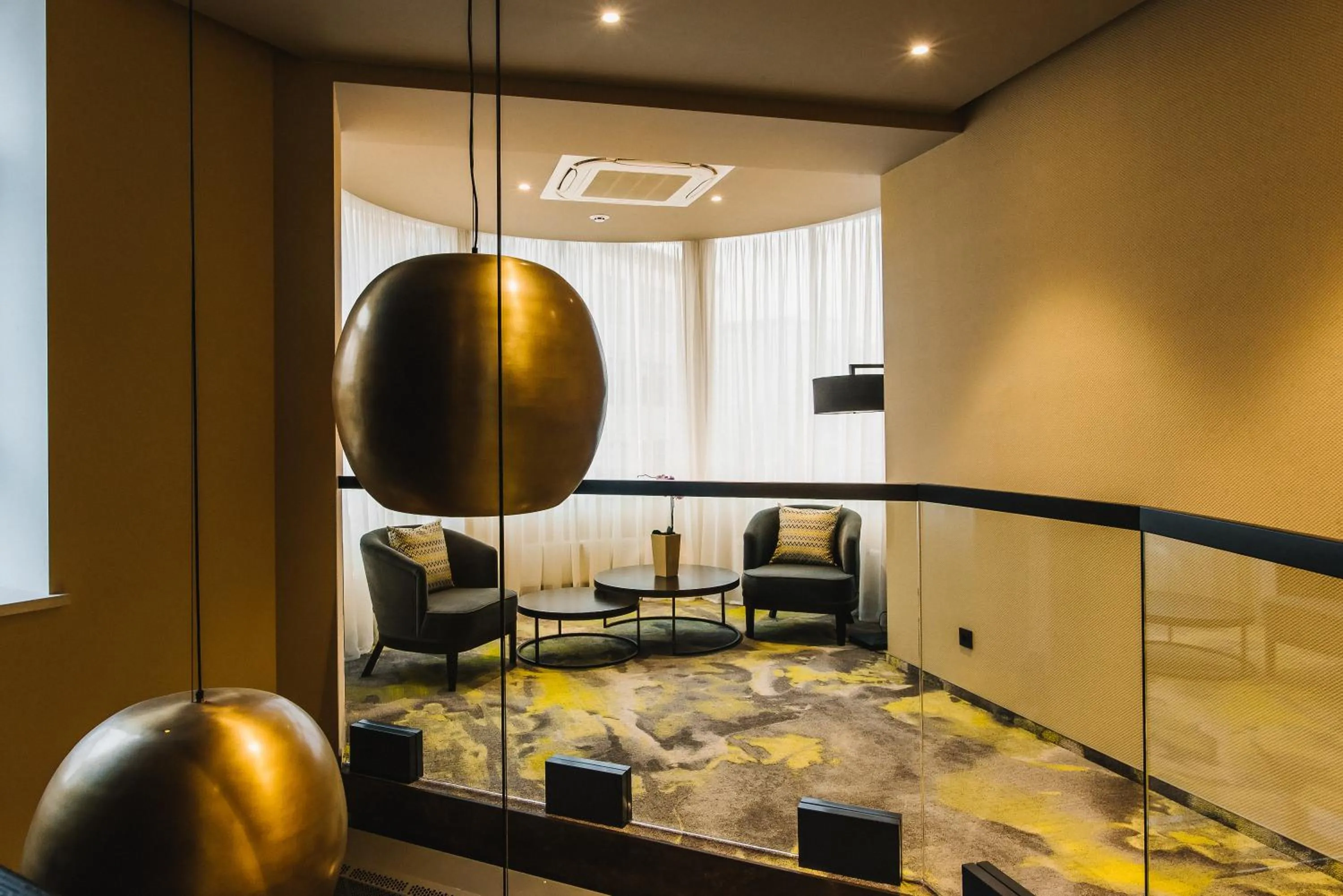 Communal lounge/ TV room in Noble Boutique Hotel