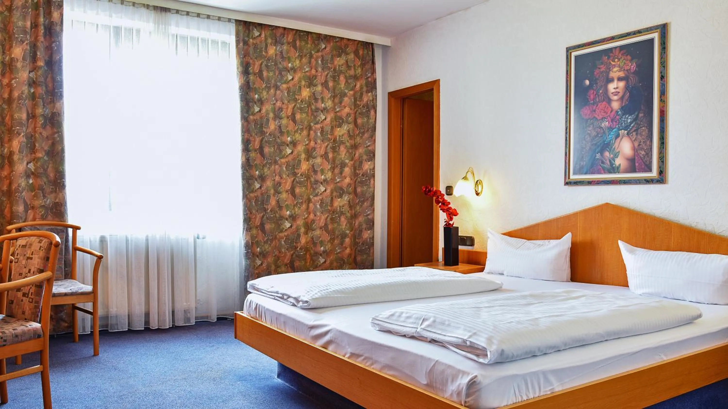 Bed in Hotel Mainbogen