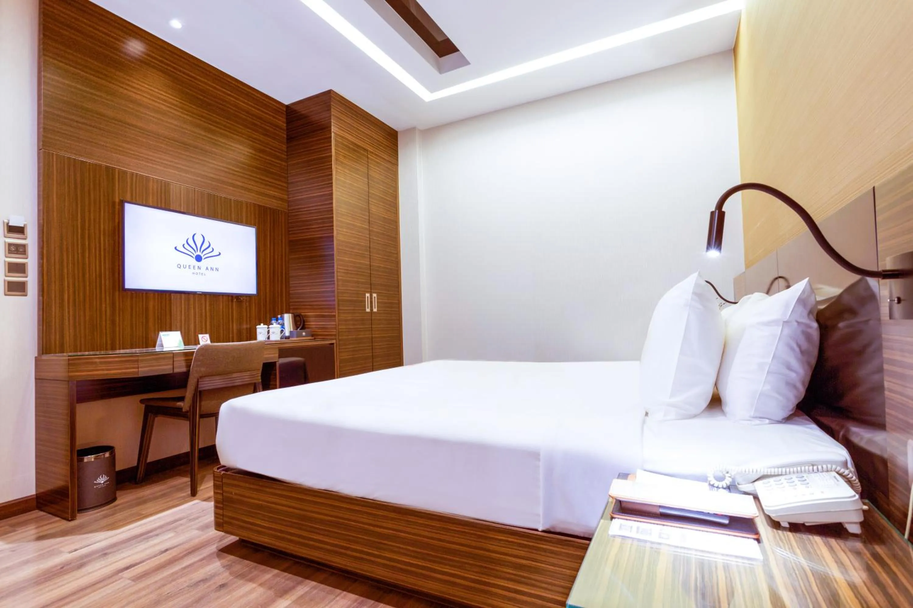 Bed in Queen Ann Hotel