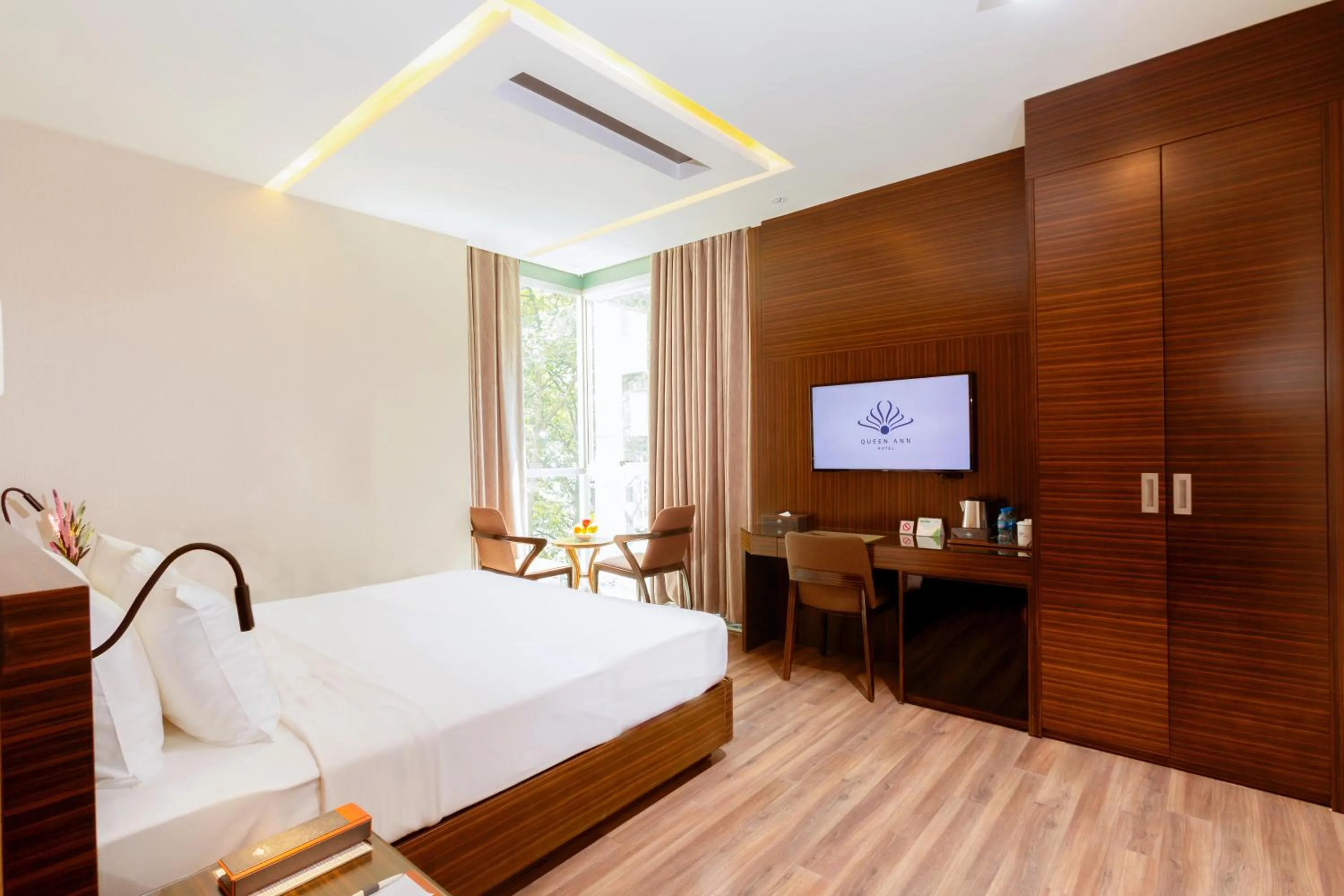 Bed in Queen Ann Hotel