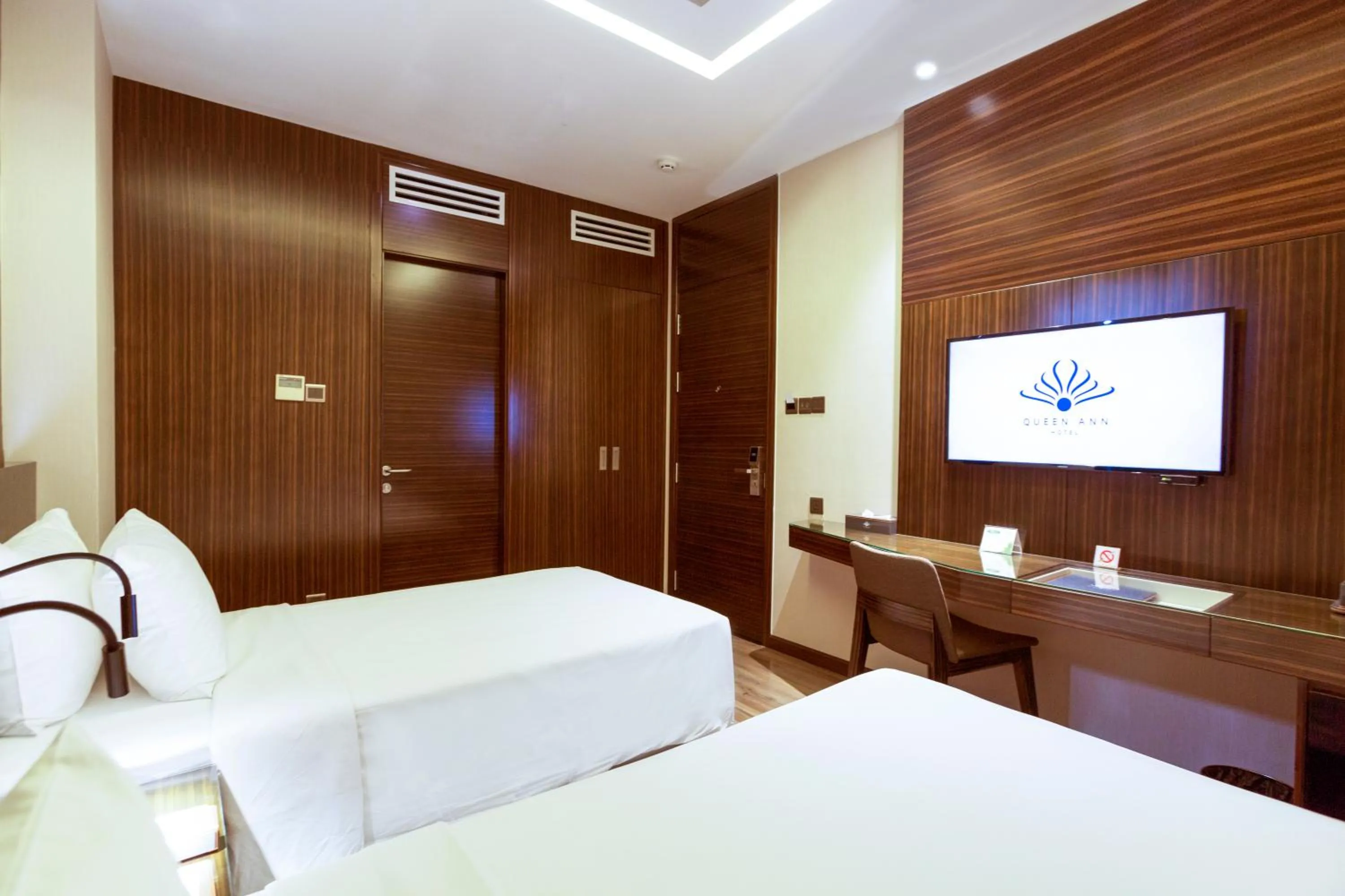 Bed in Queen Ann Hotel