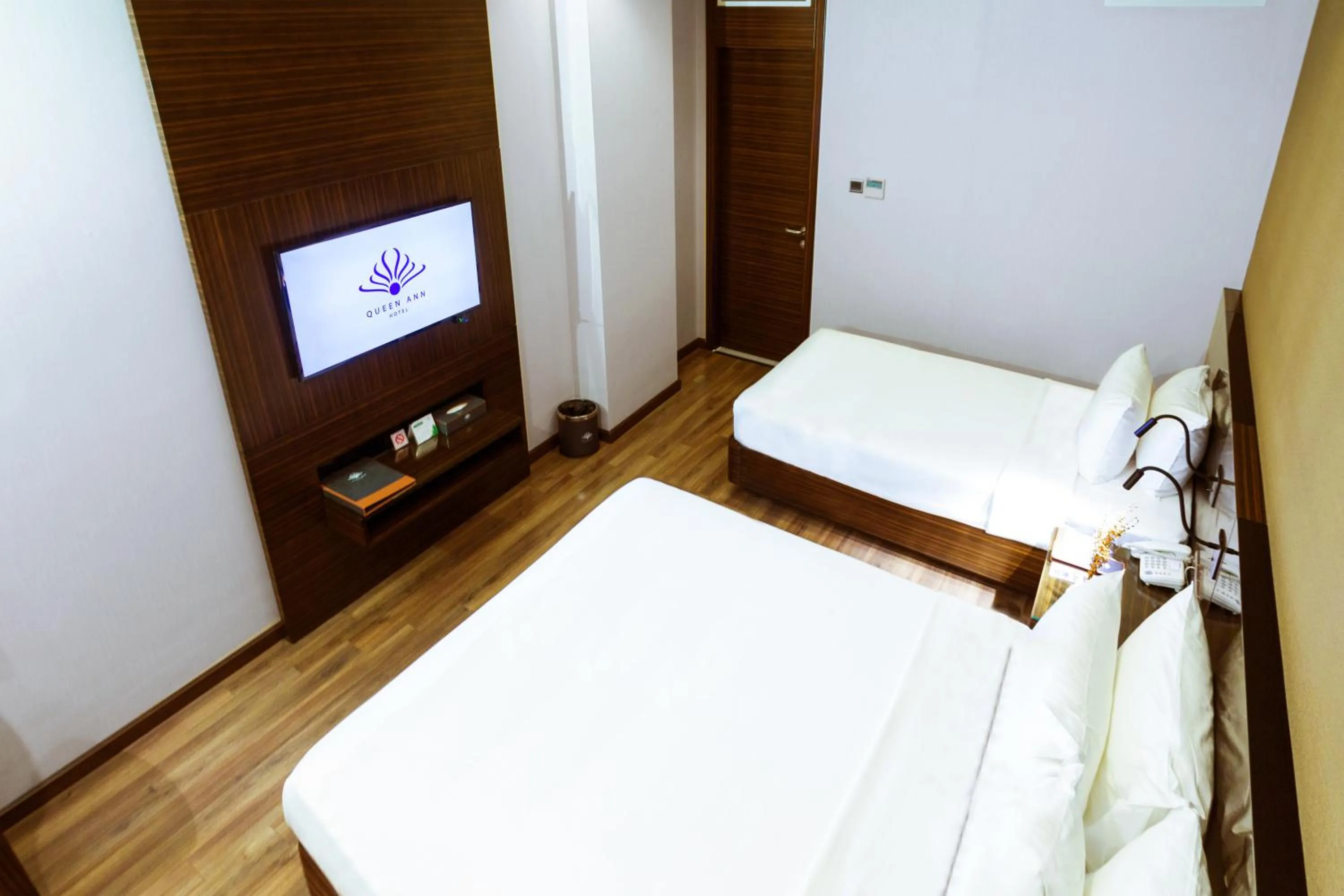 Bed in Queen Ann Hotel