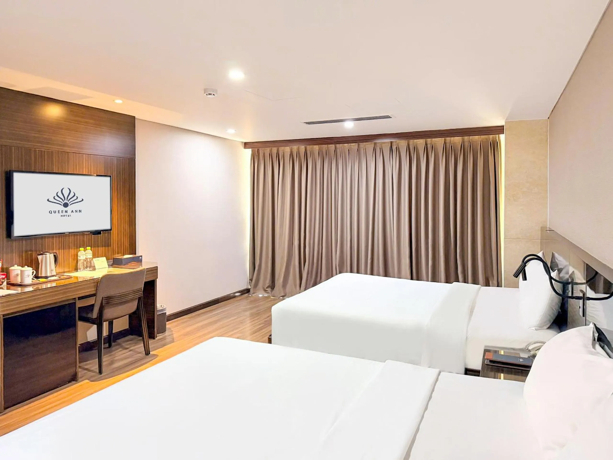 Bed in Queen Ann Hotel