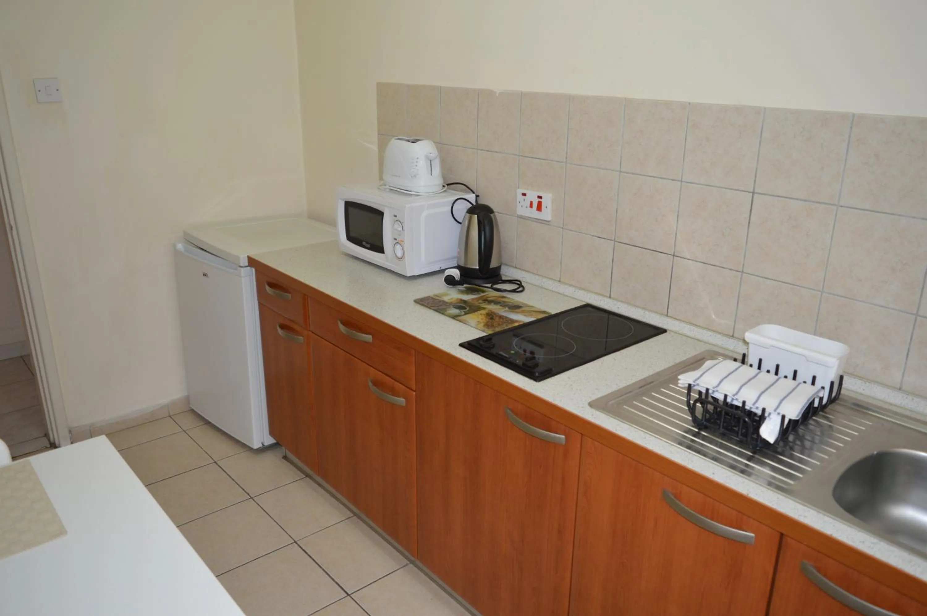 Kitchen or kitchenette in Lordos Hotel Apts Limassol