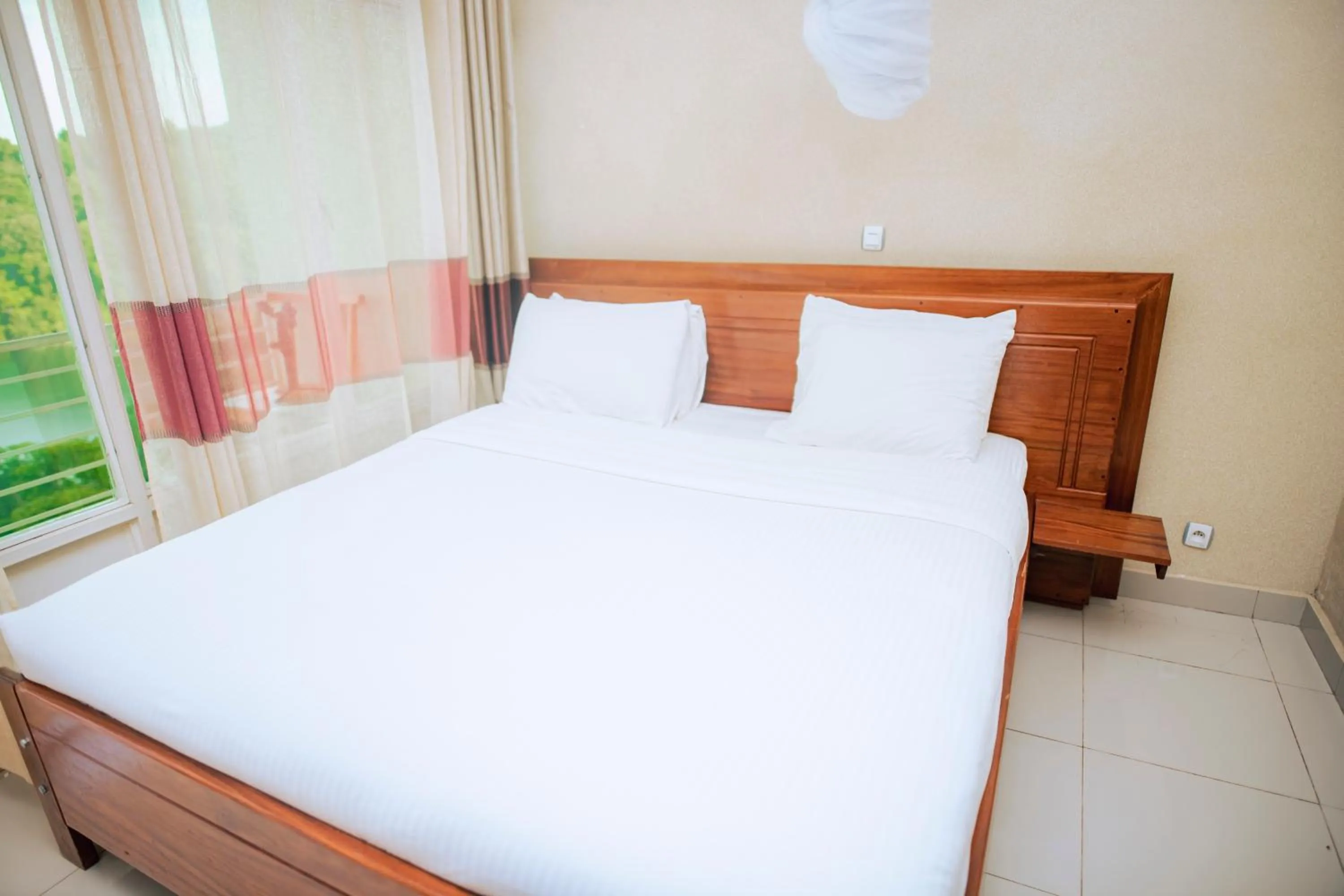 Bed in Hotel Peace Guest House