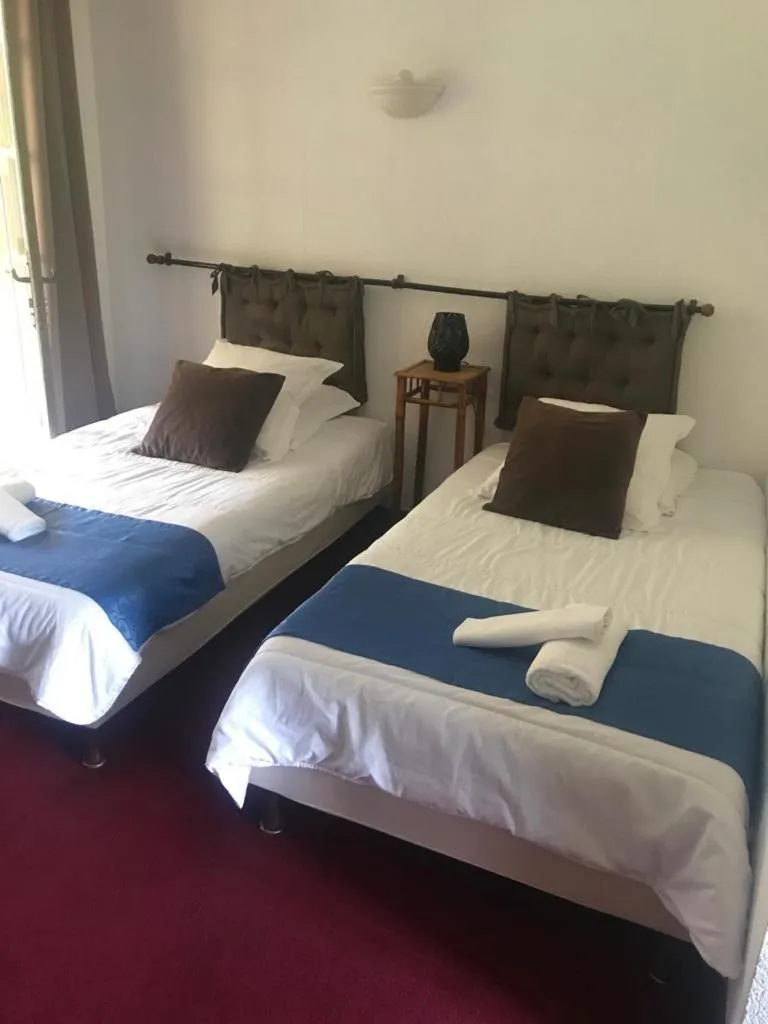 Bed in HUMAN HOTEL RESTAURANT Park