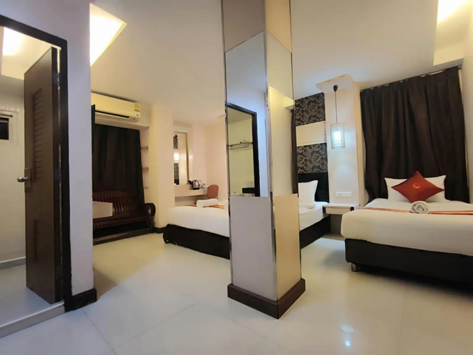 Bed in Cozi Inn Hotel, Bangkok