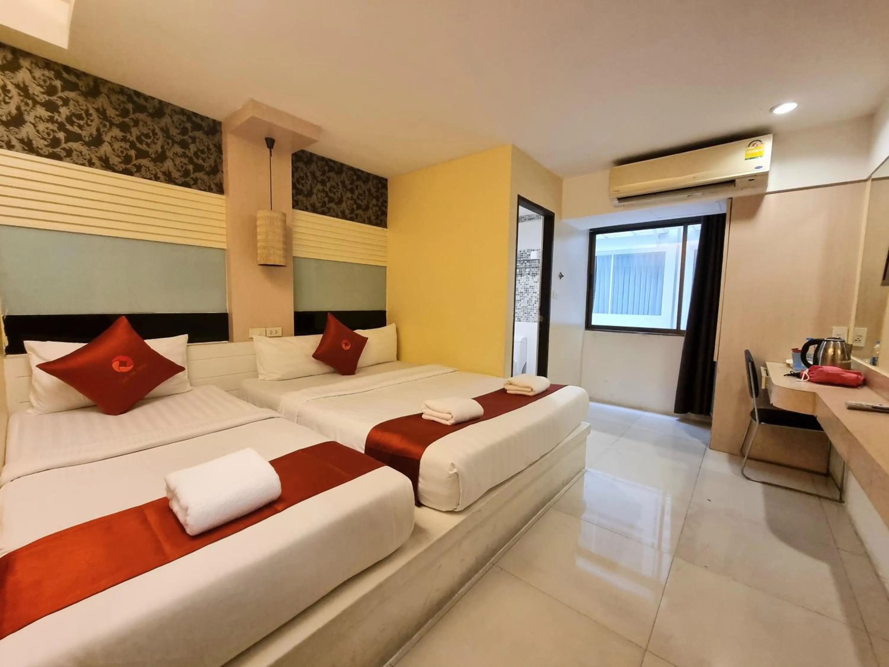 Bed in Cozi Inn Hotel, Bangkok