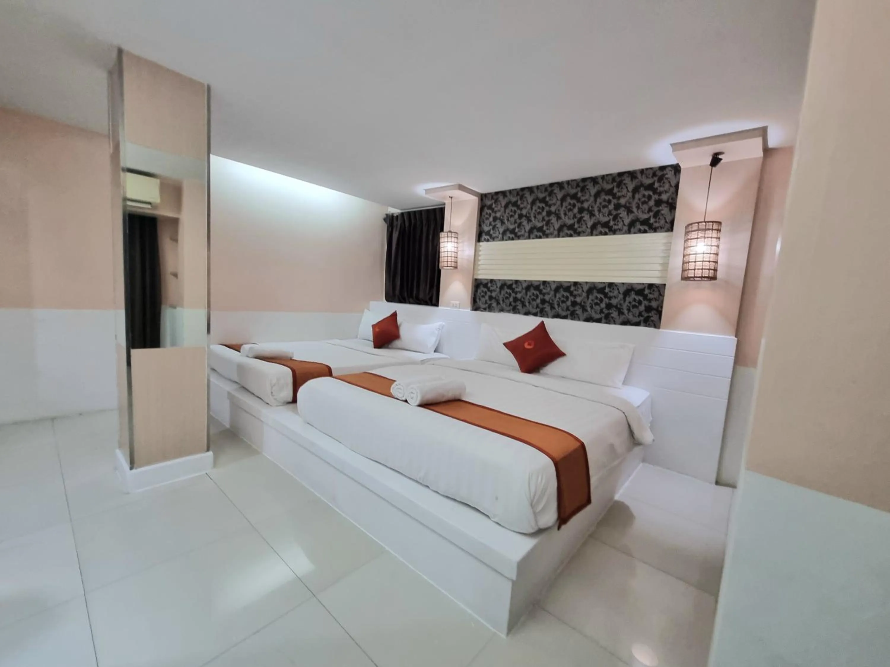 Bed in Cozi Inn Hotel, Bangkok