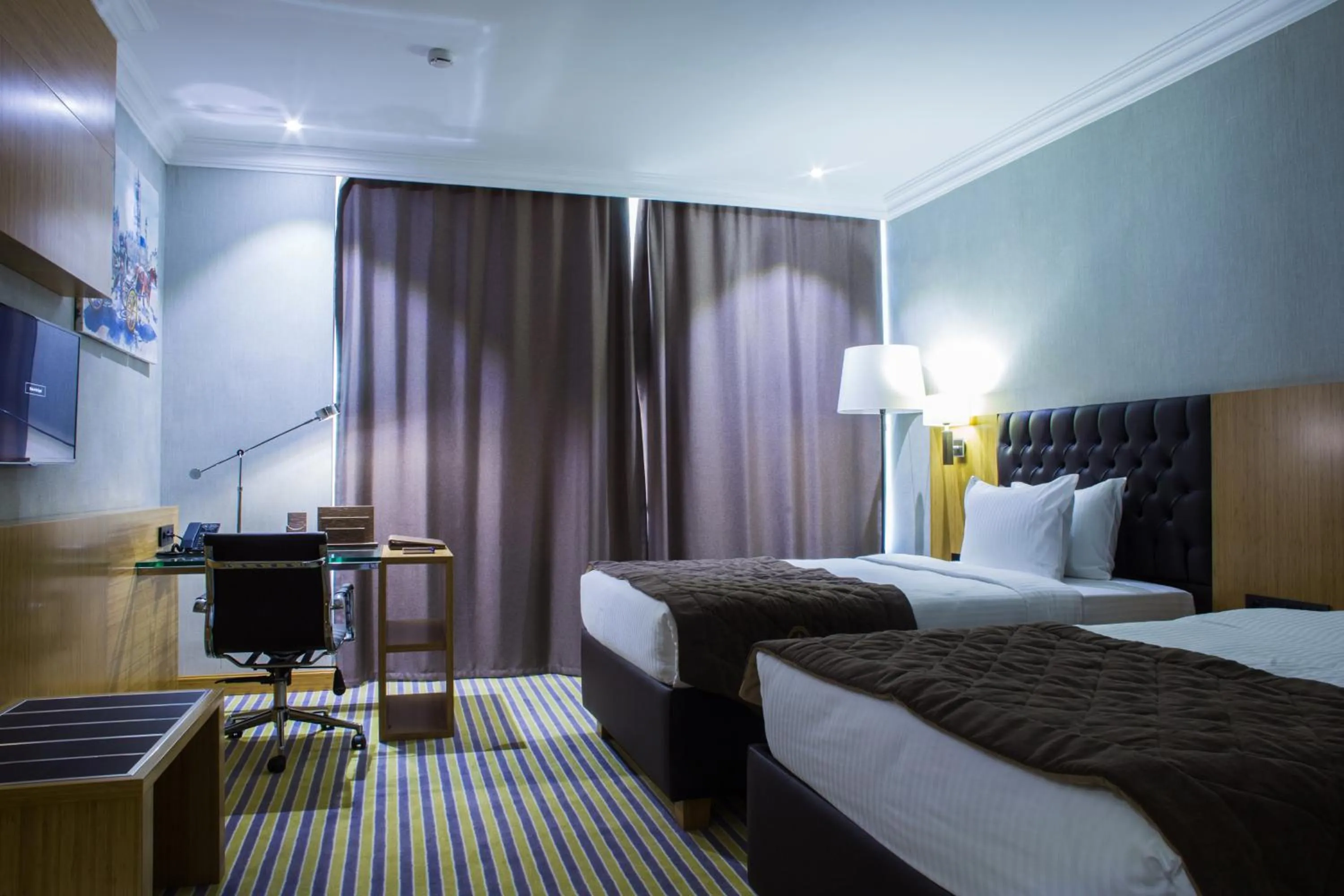 Bed in Aidana Plaza Hotel