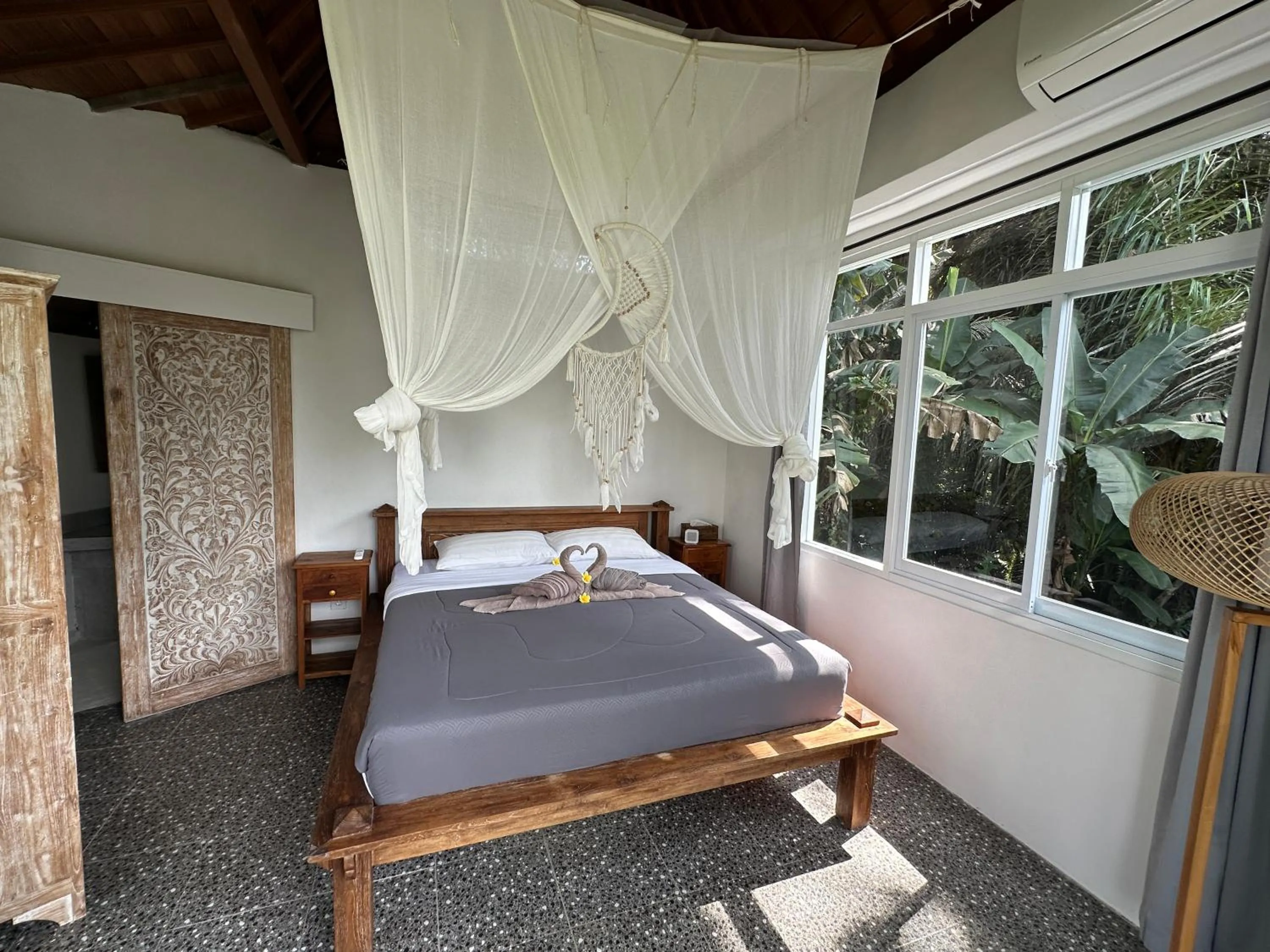 Bed in Tirta Asri Ubud Villa