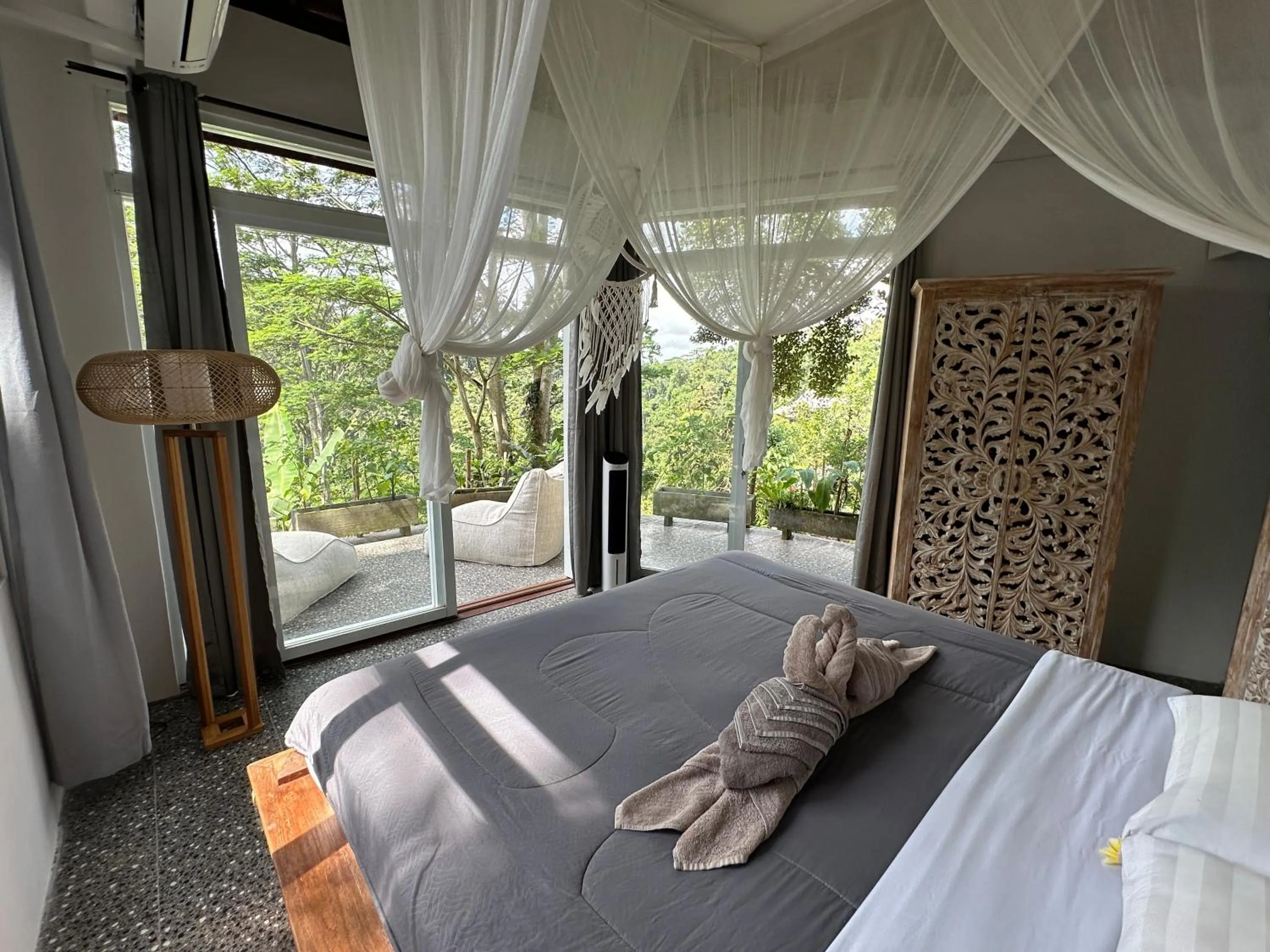 Bed in Tirta Asri Ubud Villa