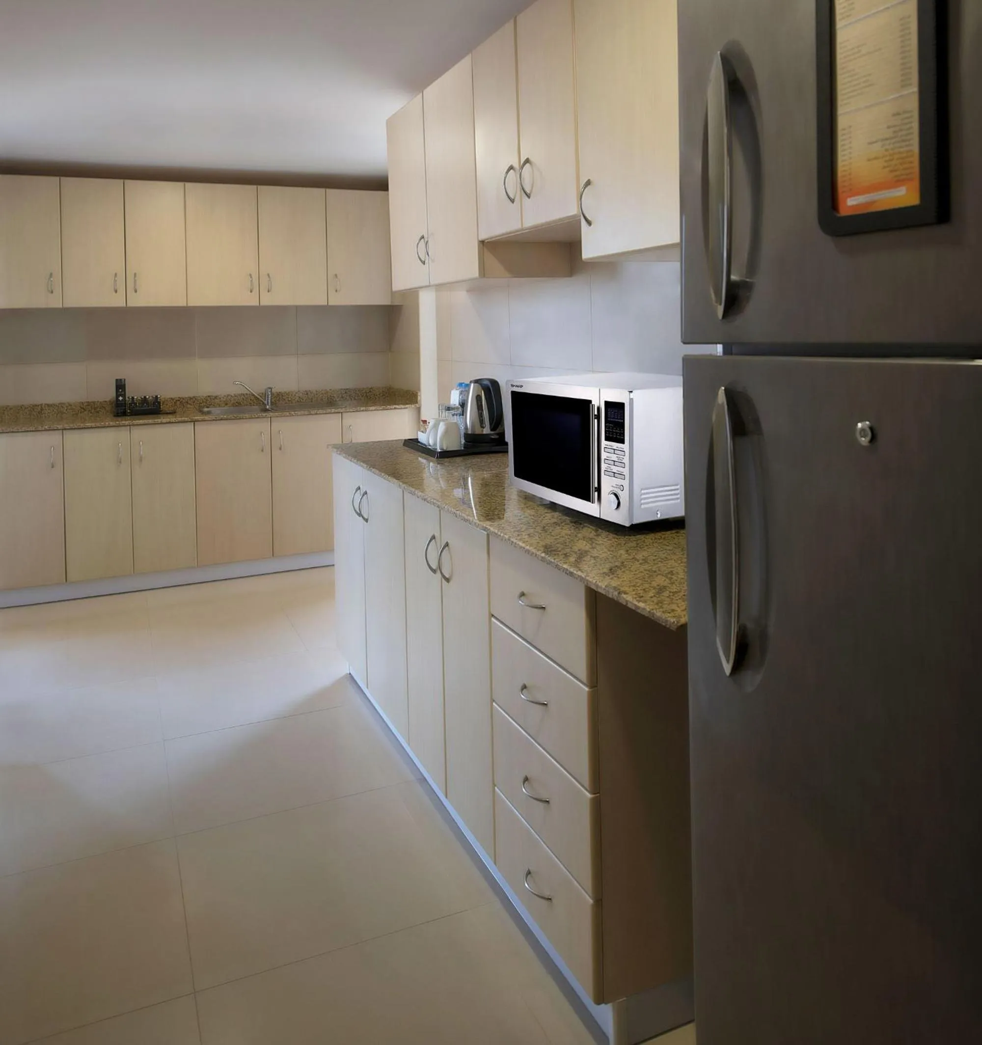 Kitchen or kitchenette in Two Seasons Hotel & Apartments