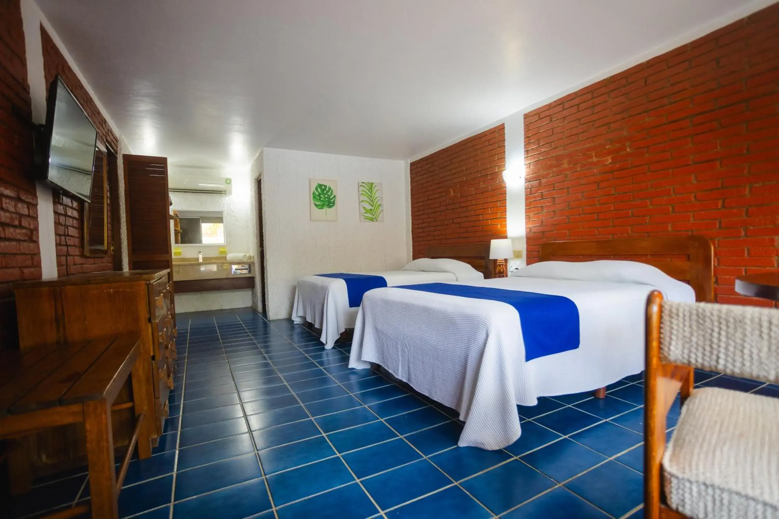 Quadruple Room with Bathroom in Hotel Plaza Palmas Quadruple Room with Bathroom in Hotel Plaza Palmas