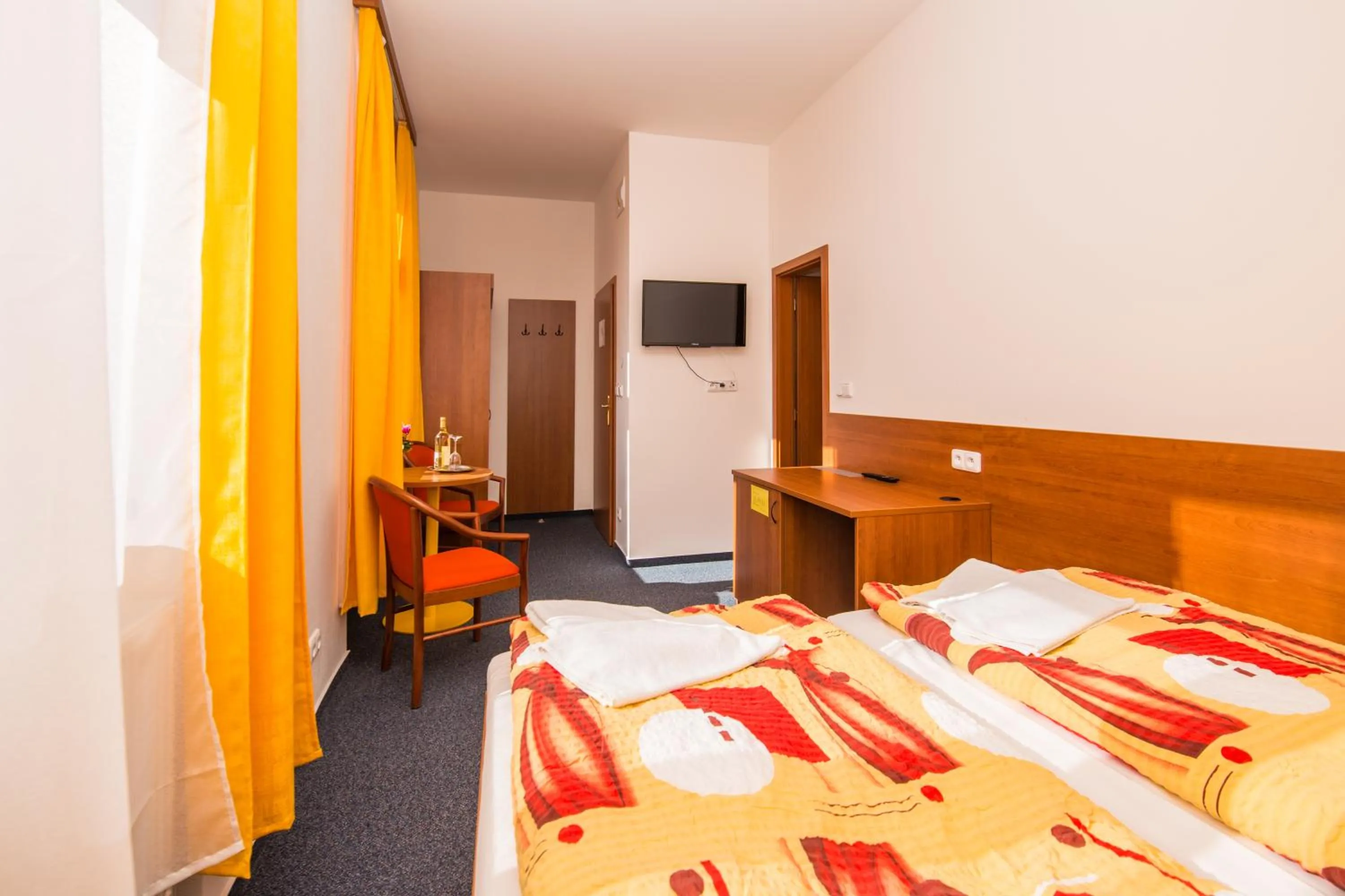 Seating area, Bed in Hotel Morava