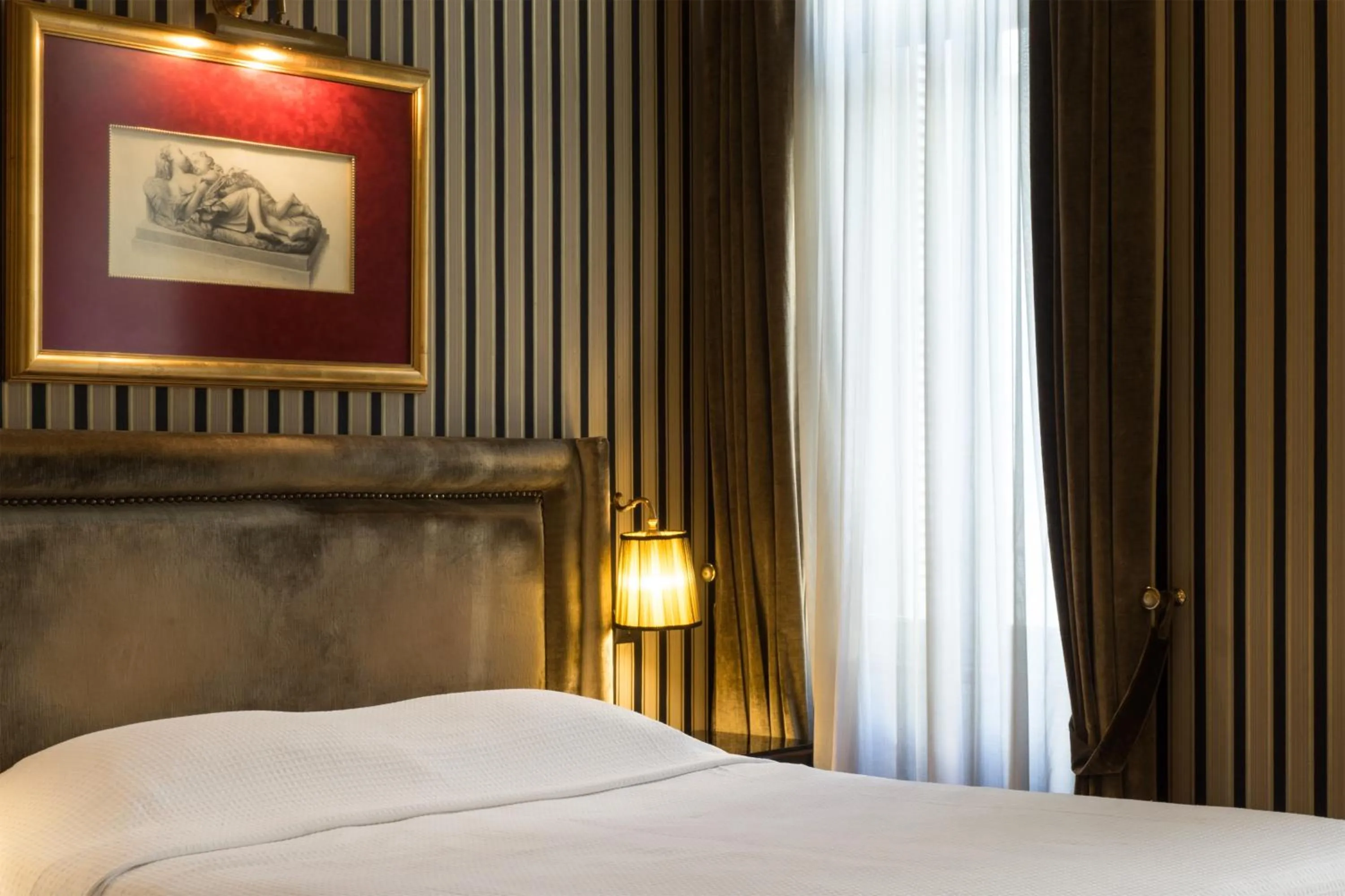 Bed in Maison Grecque Hotel Extraordinaire