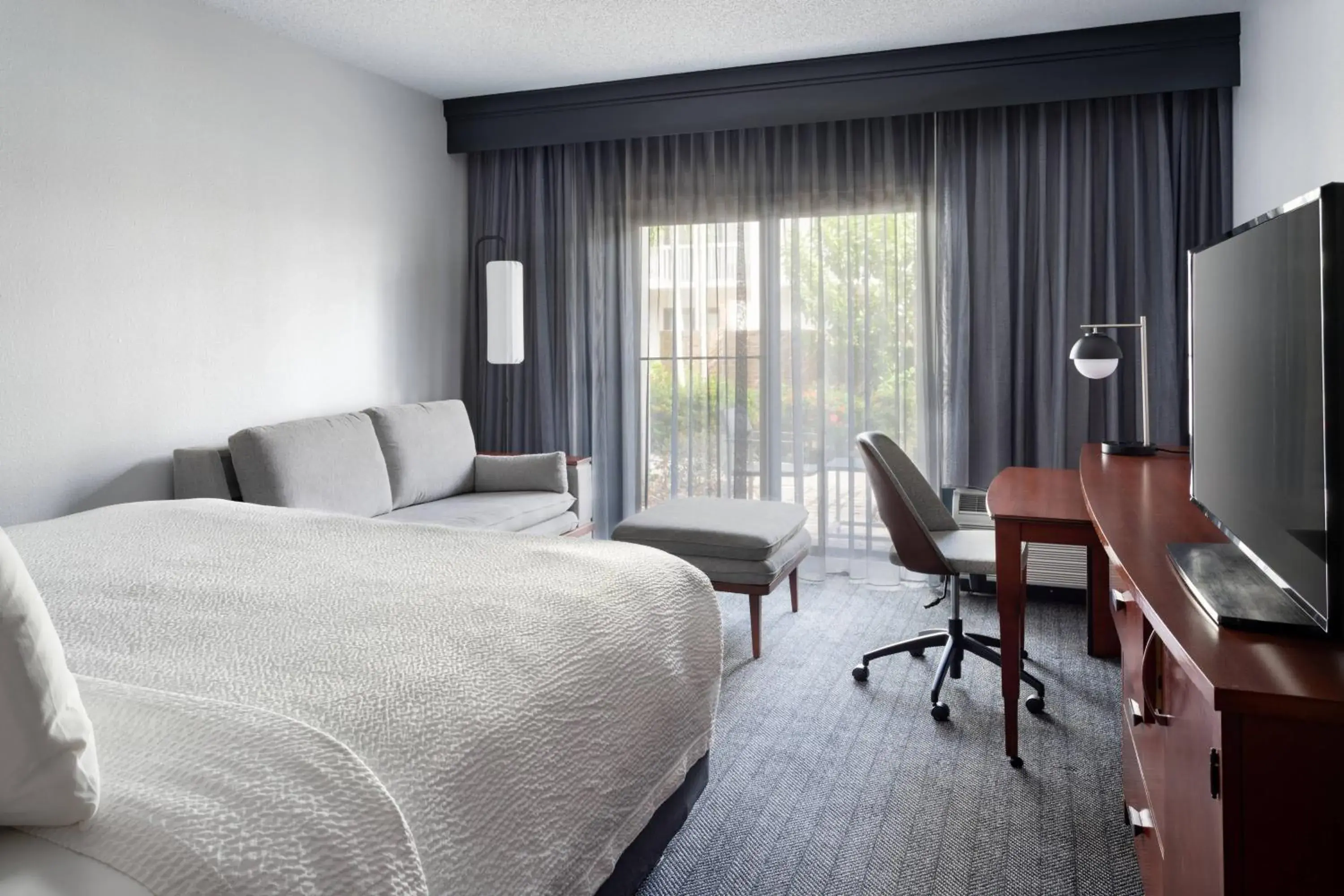 Guest room, 1 King, Sofa bed, Courtyard view in Courtyard by Marriott West Palm Beach Guest room, 1 King, Sofa bed, Courtyard view in Courtyard by Marriott West Palm Beach