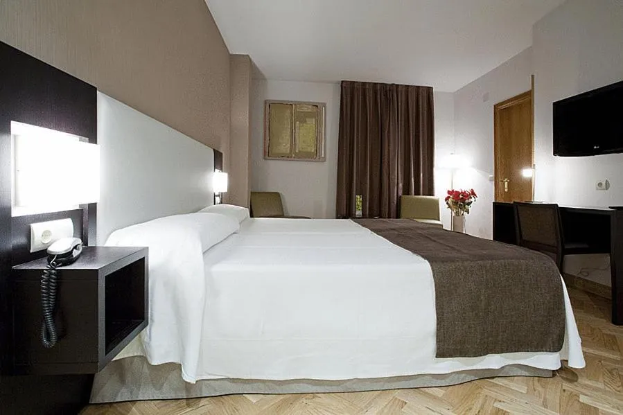 Photo of the whole room, Bed in Hostal Carlos III