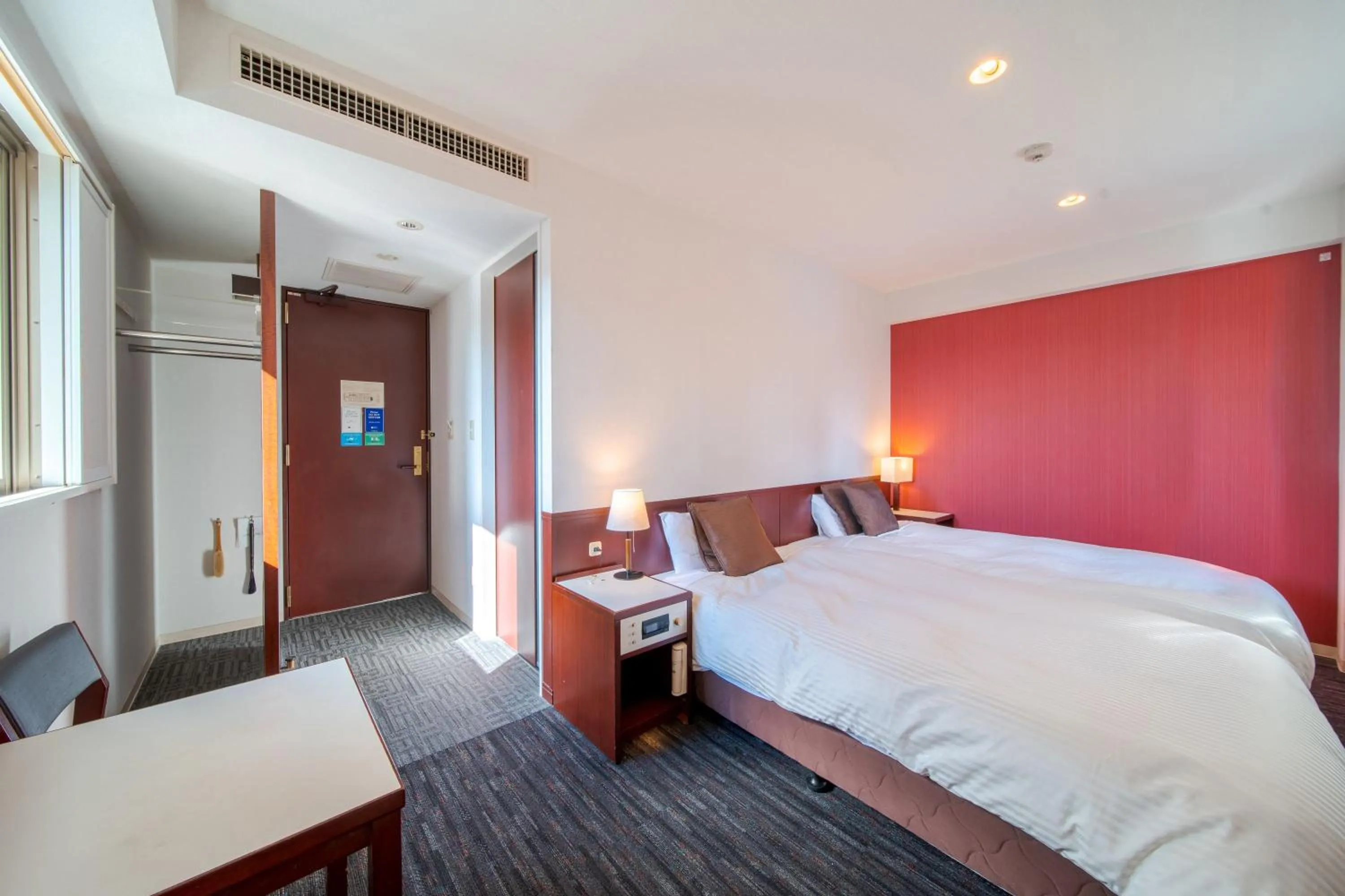 Bed in Meitetsu Inn Nagoya Ekimae