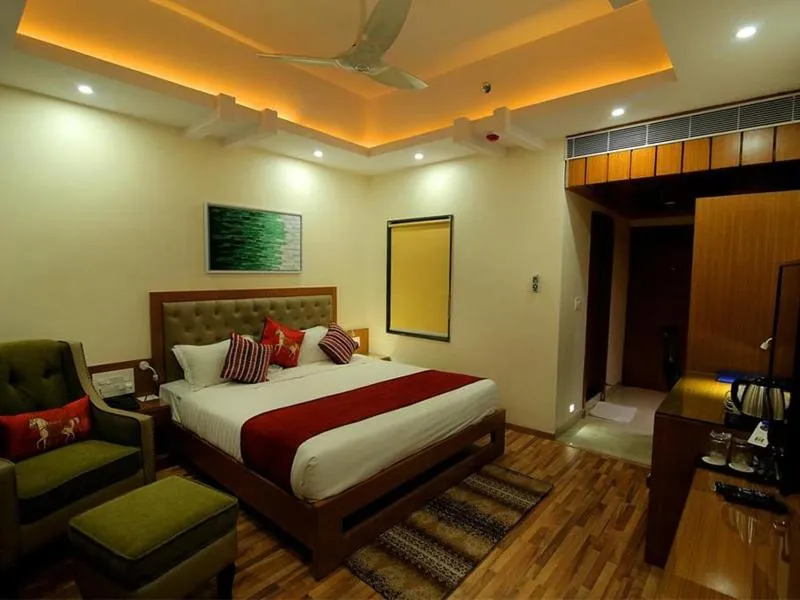 Photo of the whole room, Bed in Hotel Hampi International