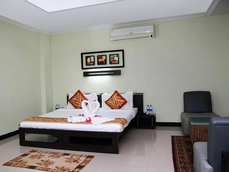 Photo of the whole room, Bed in Hotel Hampi International